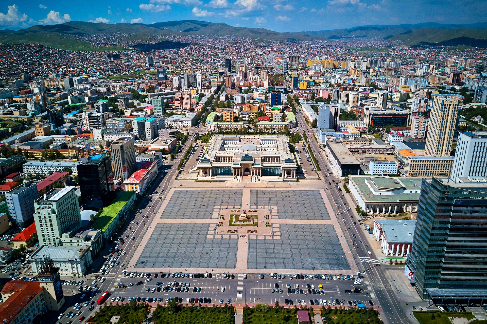 High view of large city with a public square in the foreground