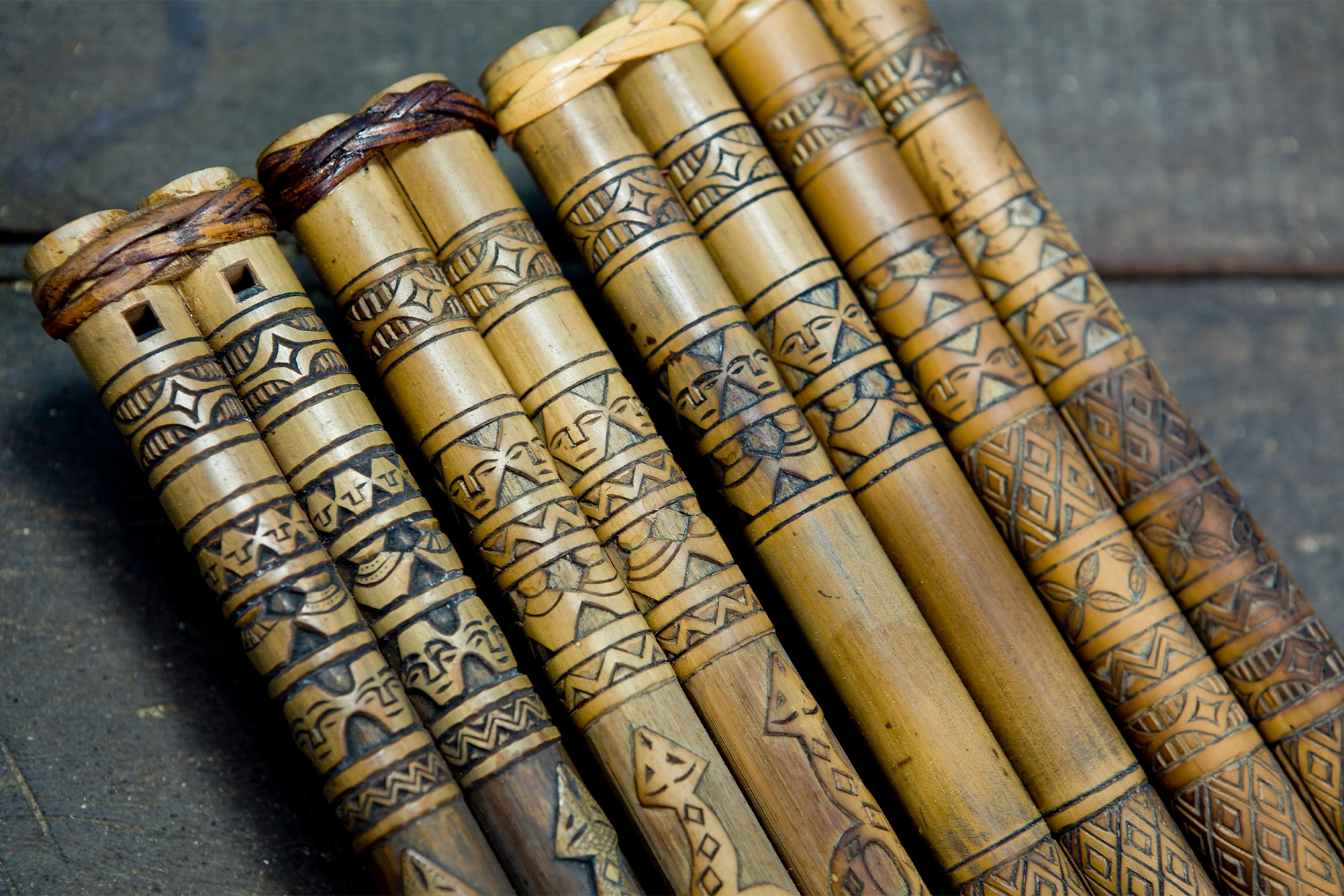 Three decorated wooden double-barrelled flutes