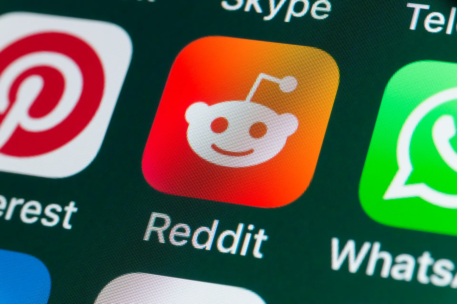 Phone screen with Reddit app icon