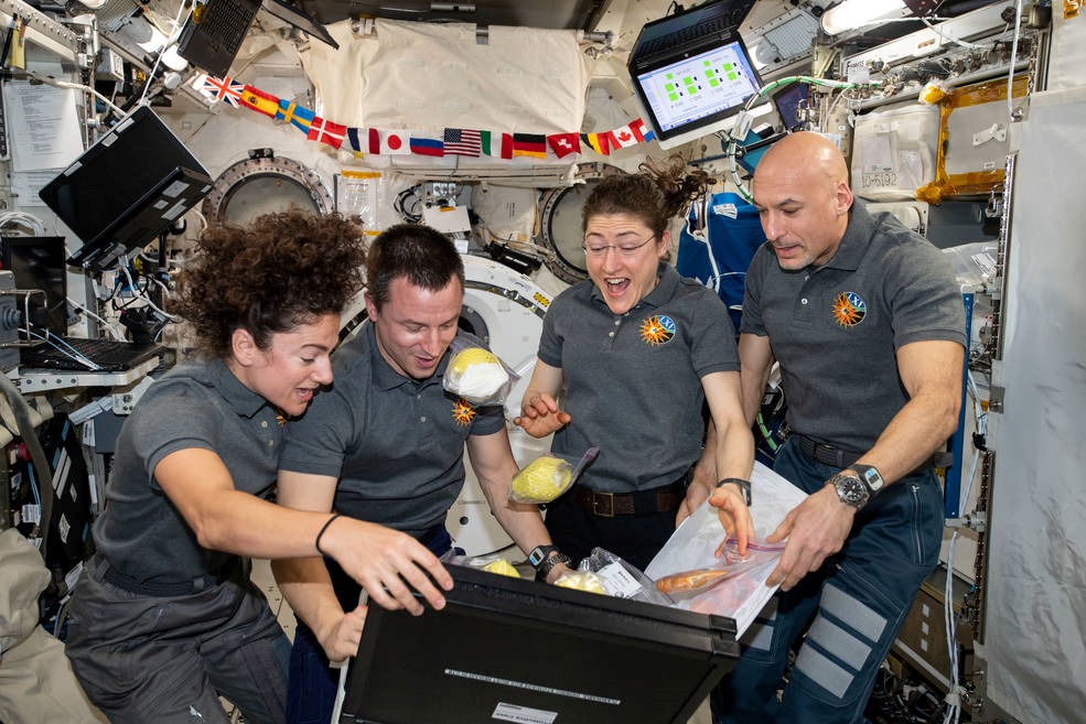 Methods like sterilisation, irradiation and freeze-drying are essential for preserving food in space.. From left are NASA flight engineers Jessica Meir, Andrew Morgan, and Christina Koch with ESA Commander Luca Parmitano. Picture: NASA