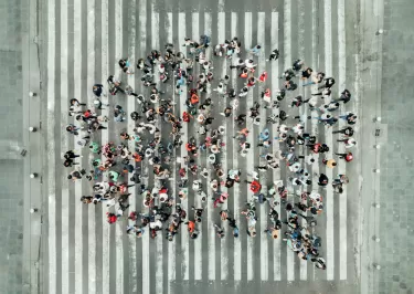 A crowd of people in the shape of a speech bubble