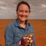 Profile of Lisa Schwanz holding a lizard