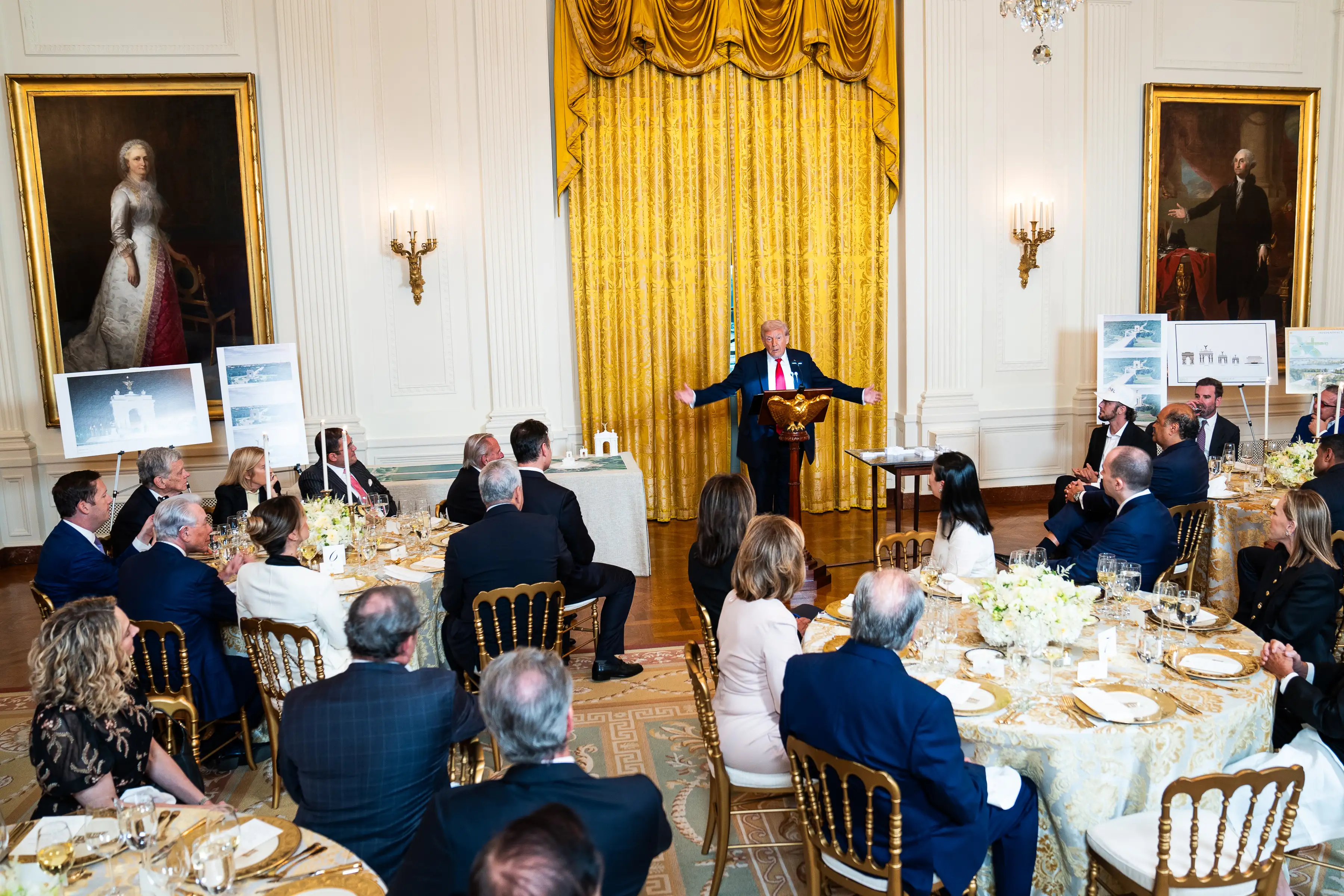 US President Donald Trump delivers remarks during a ballroom fundraising dinner