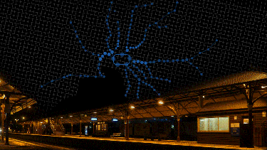 Animation of train travelling through train station at night with a map of Melbourne stations over the night sky
