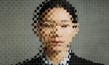 A pixelated image of a woman's face