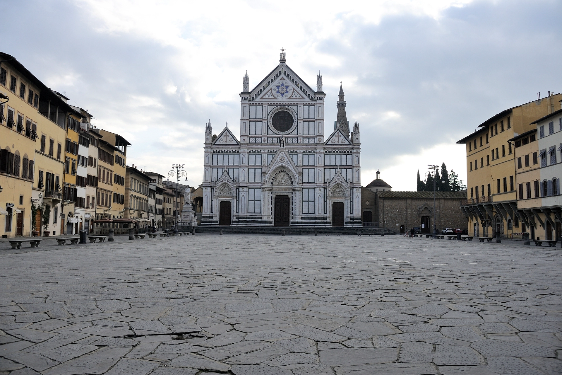 Empty Florence piazza with church in background