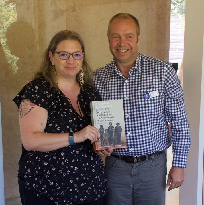 Barry Judd and Kirsten Kozar holding a book