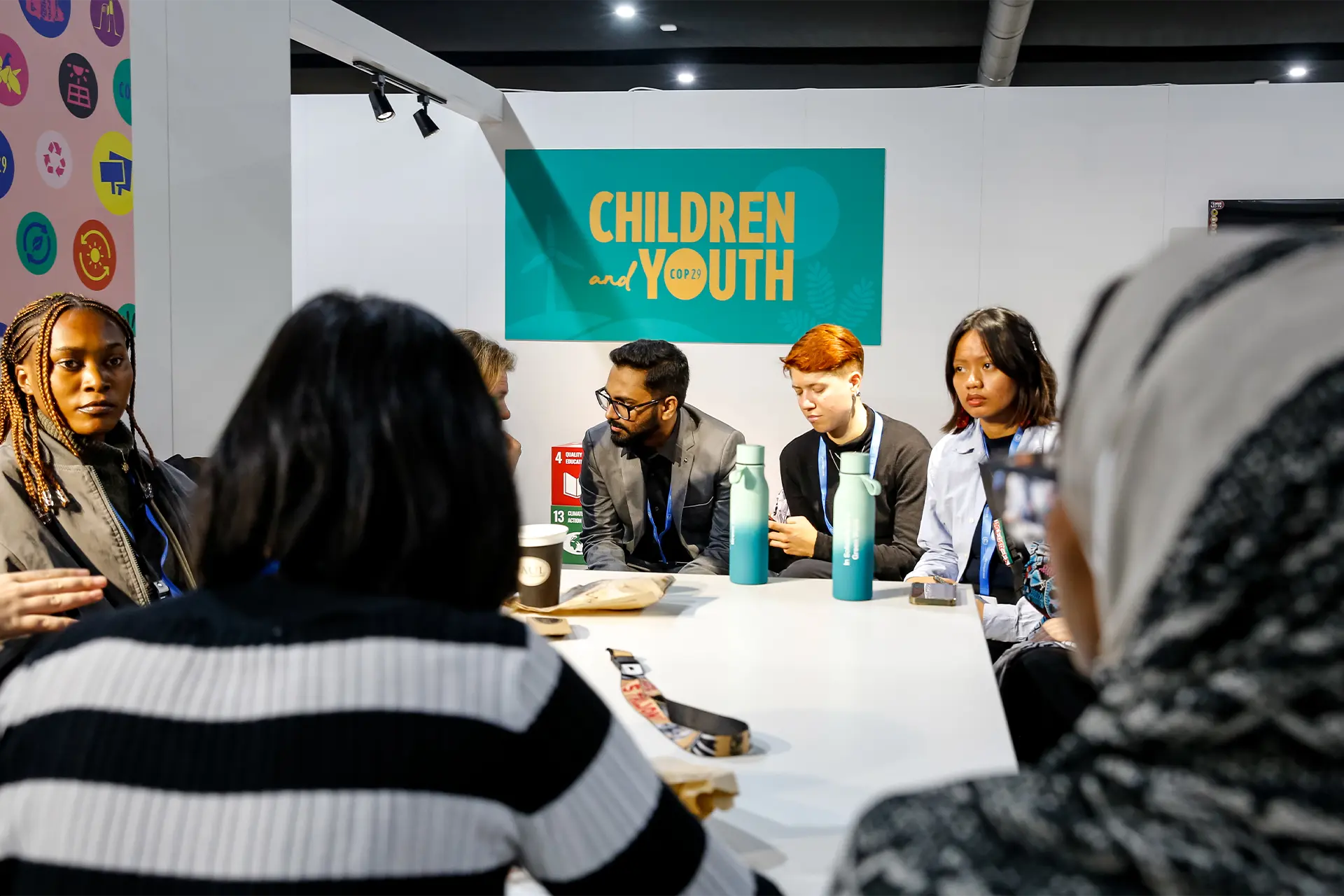 A group of young people meeting around a table