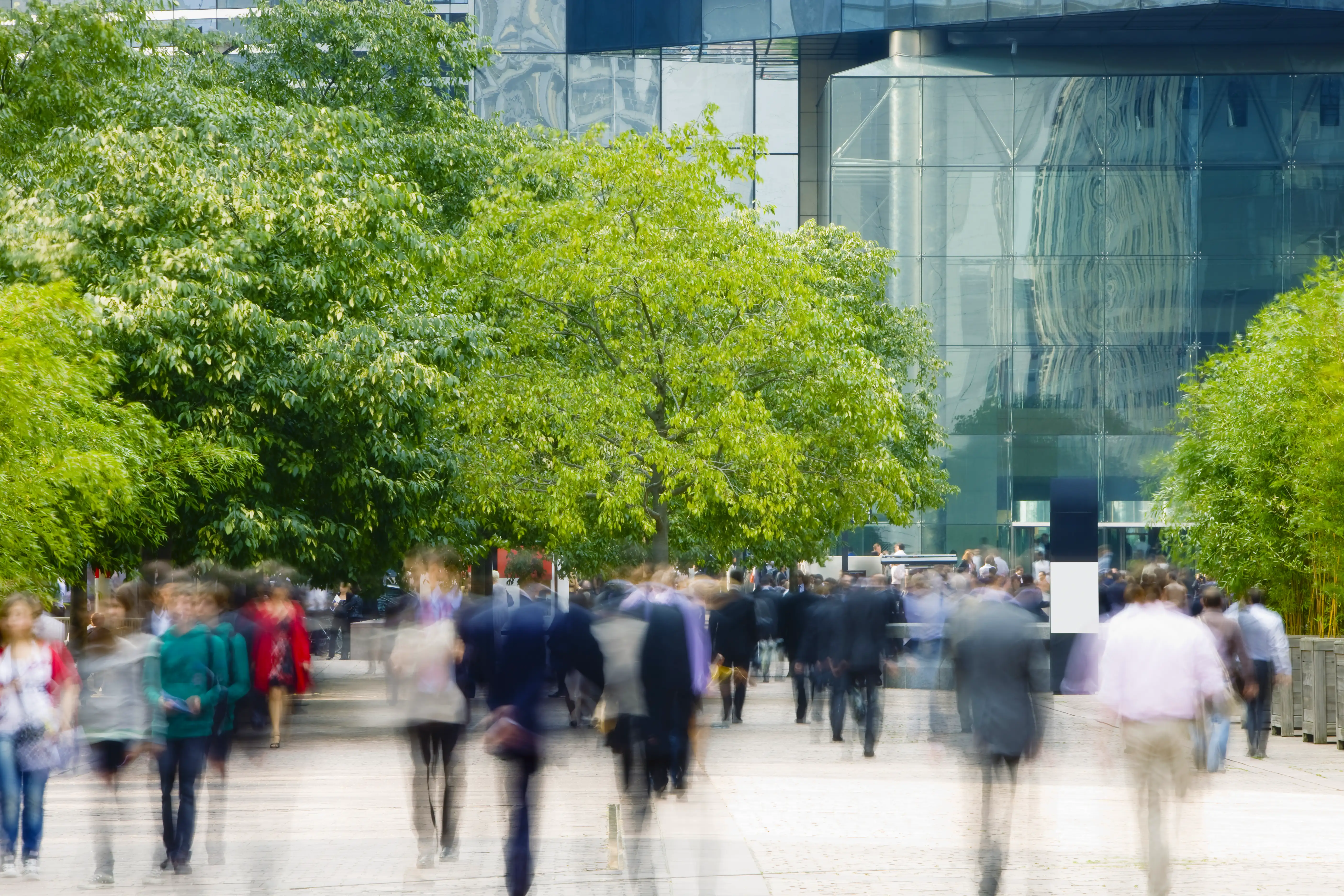 Blurred workers walking in a financial district