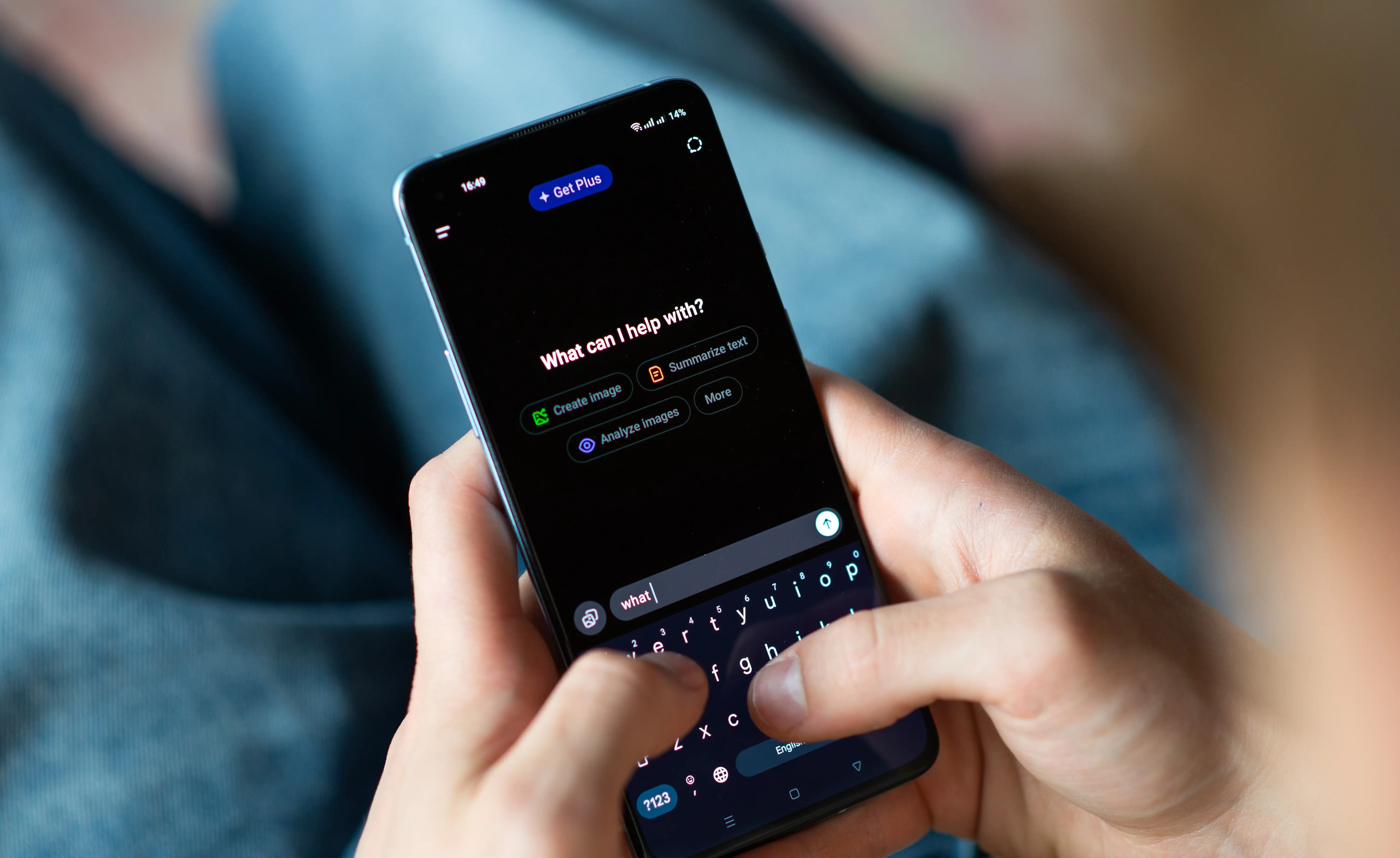Close-up of a person using a smartphone with the ChatGPT app open