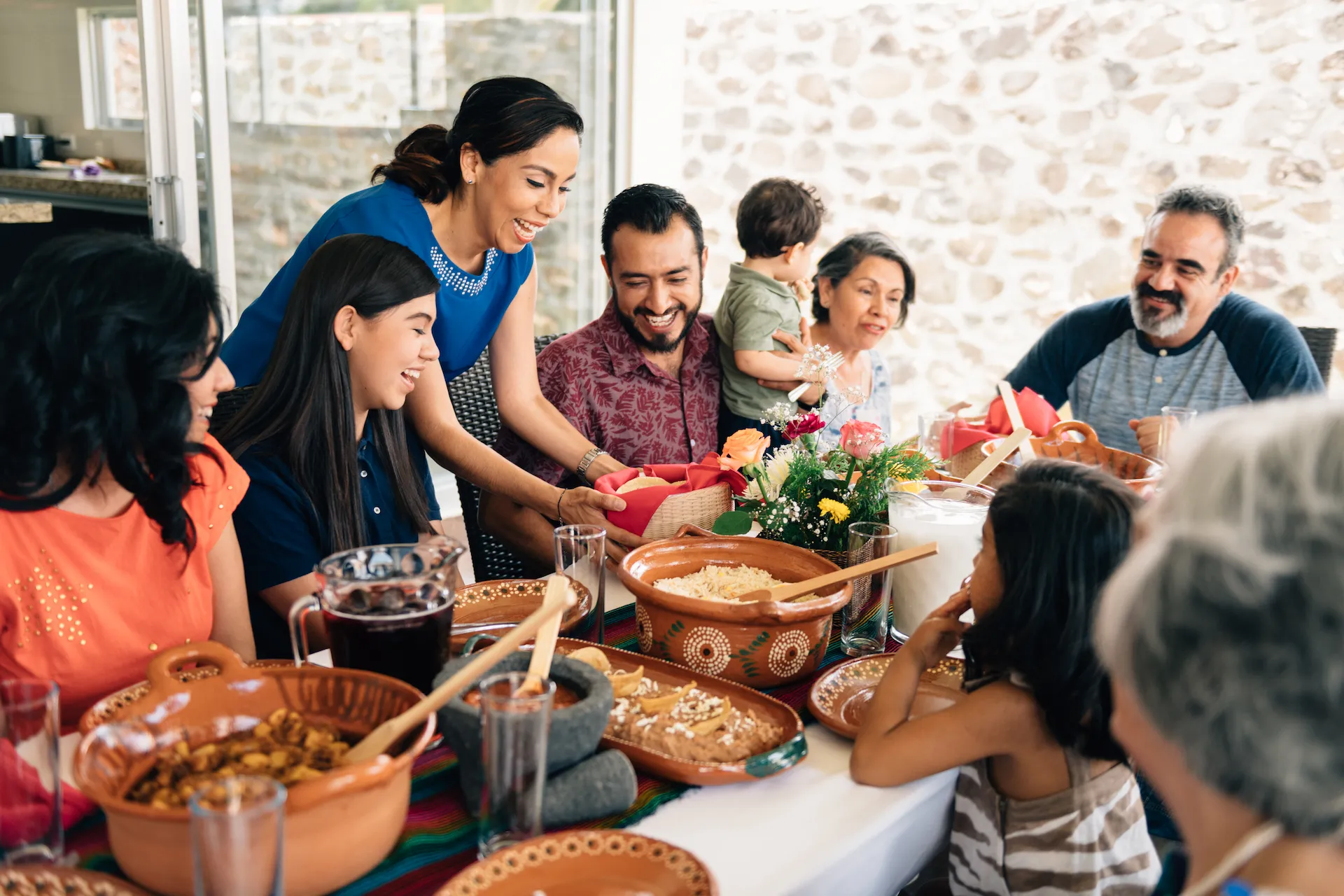 Large family sitting down to a shared meal