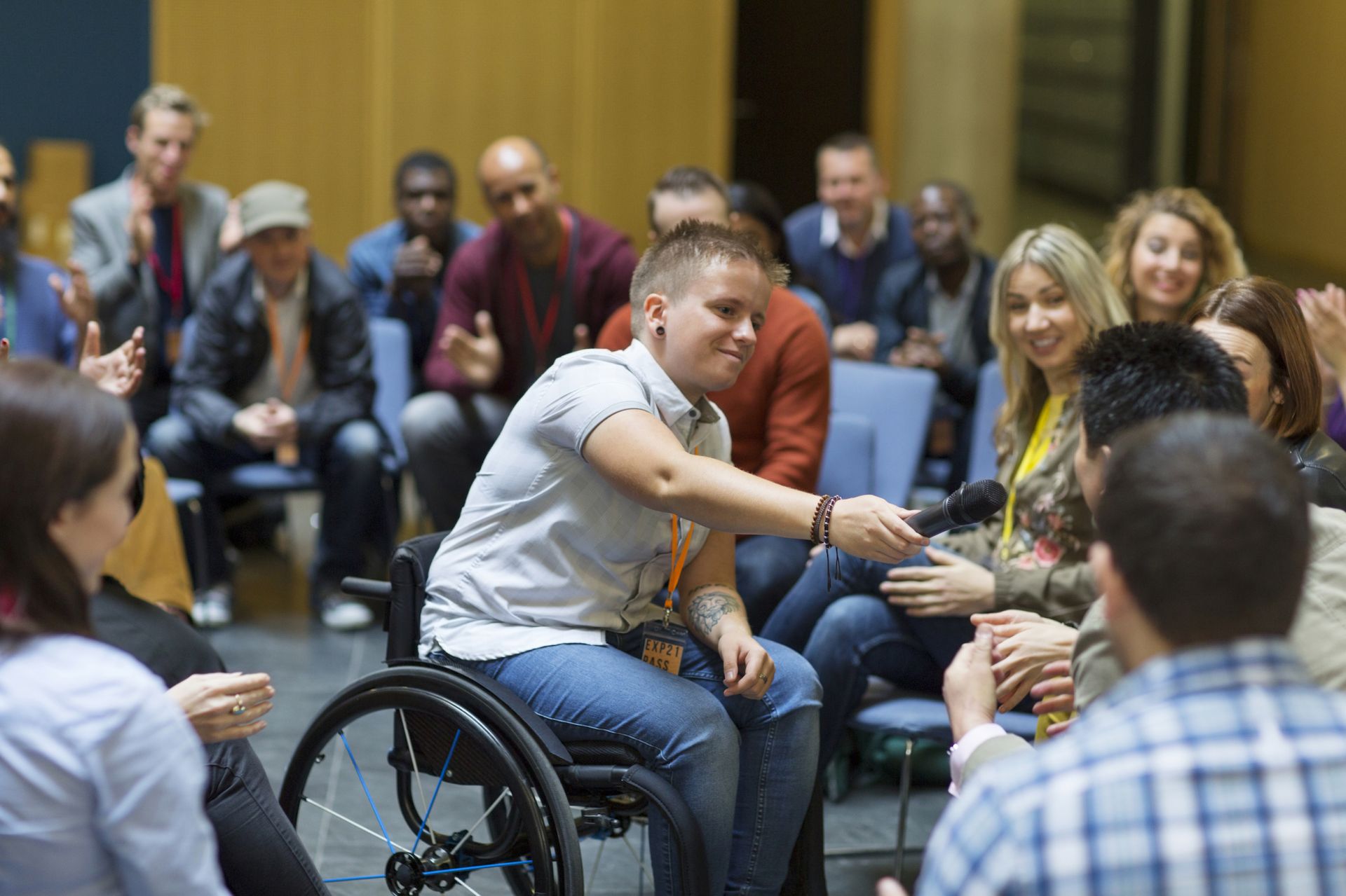 Young person in wheelchair leading a meeting