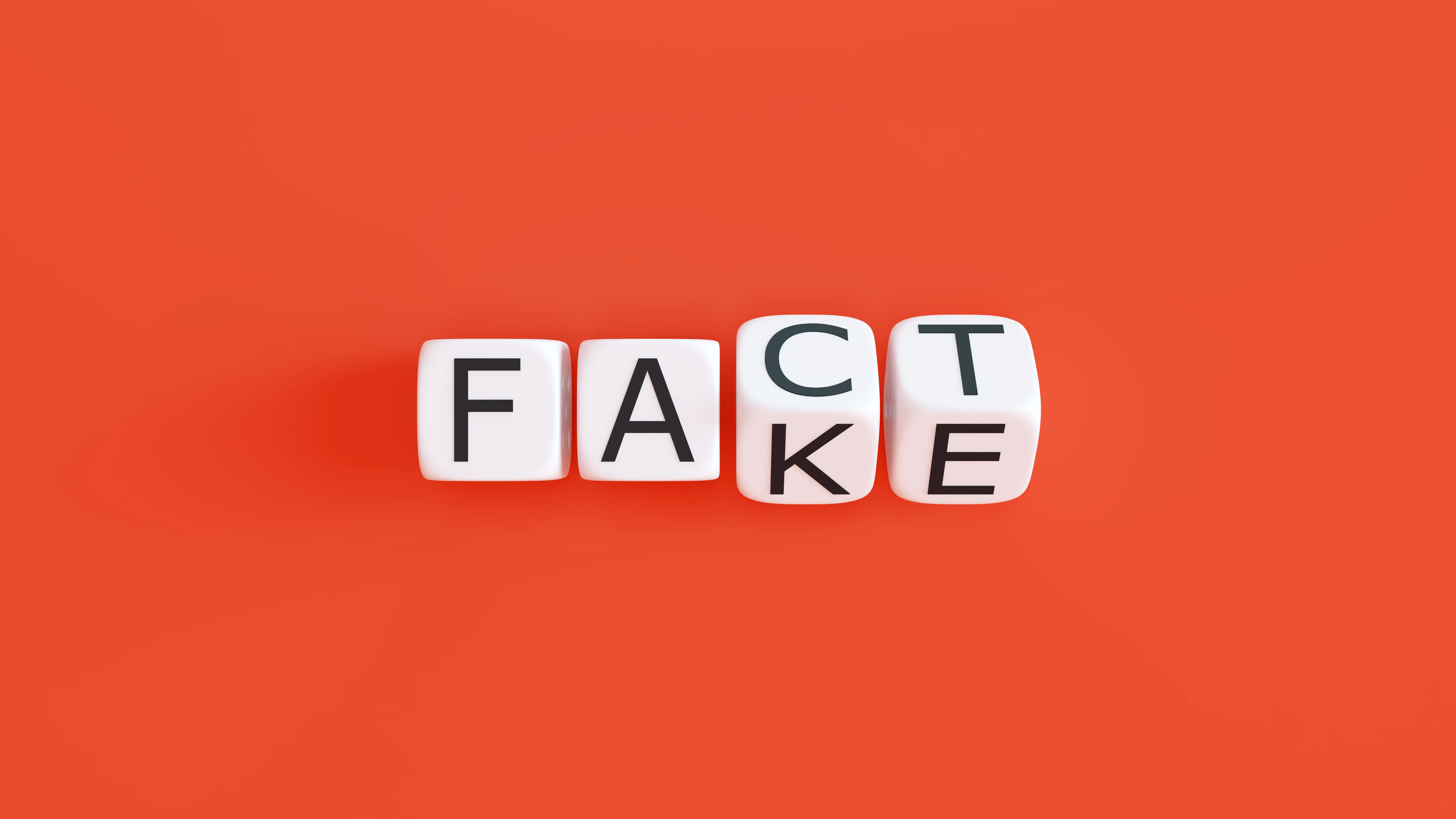 Fact and fake spelled out on a red background