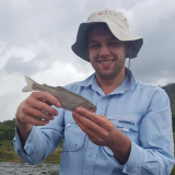 Jonathan Curran holding a fish