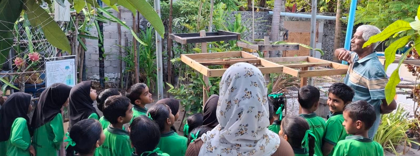 class with educator in garden