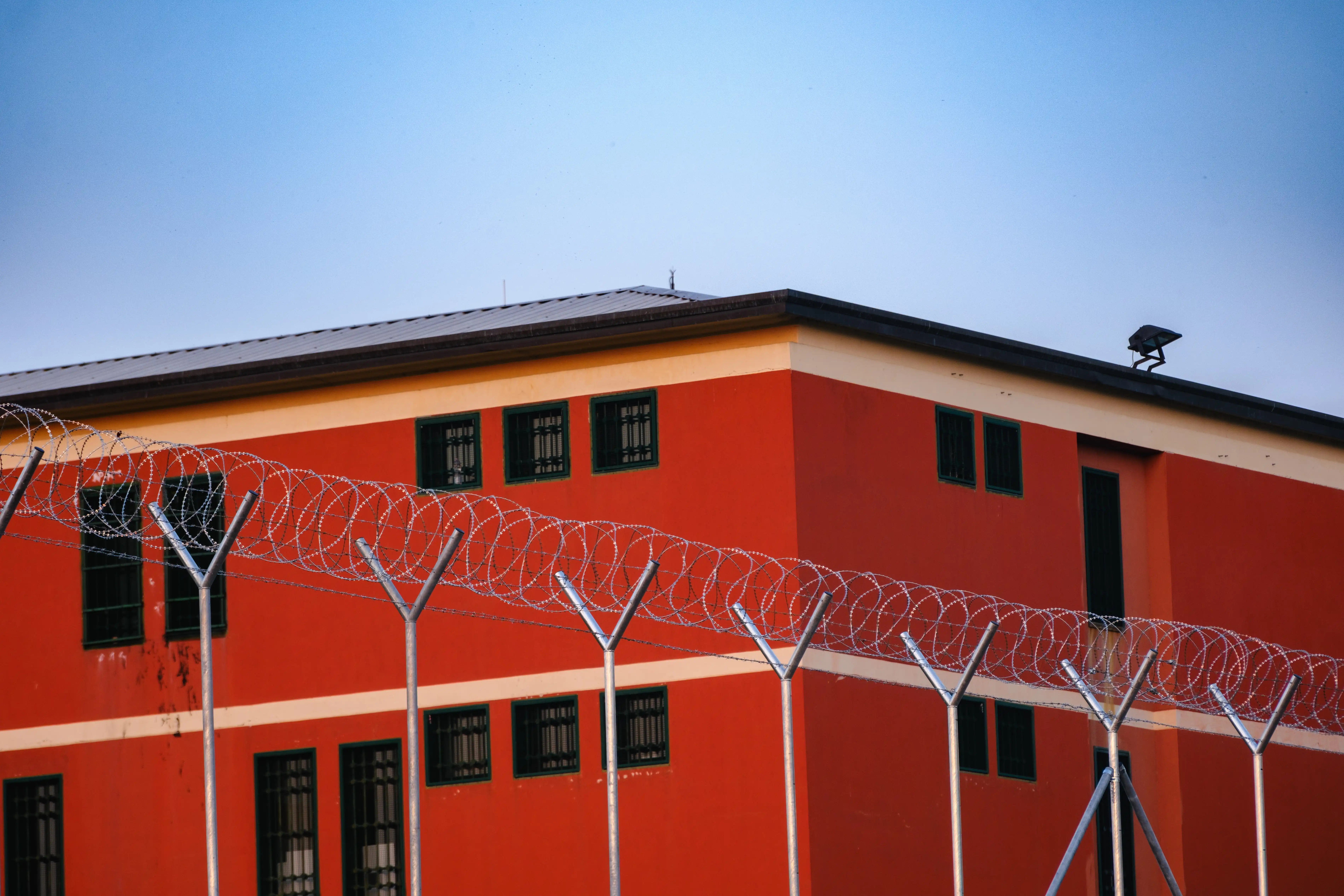 Razor wire in front of a detention centre or prison