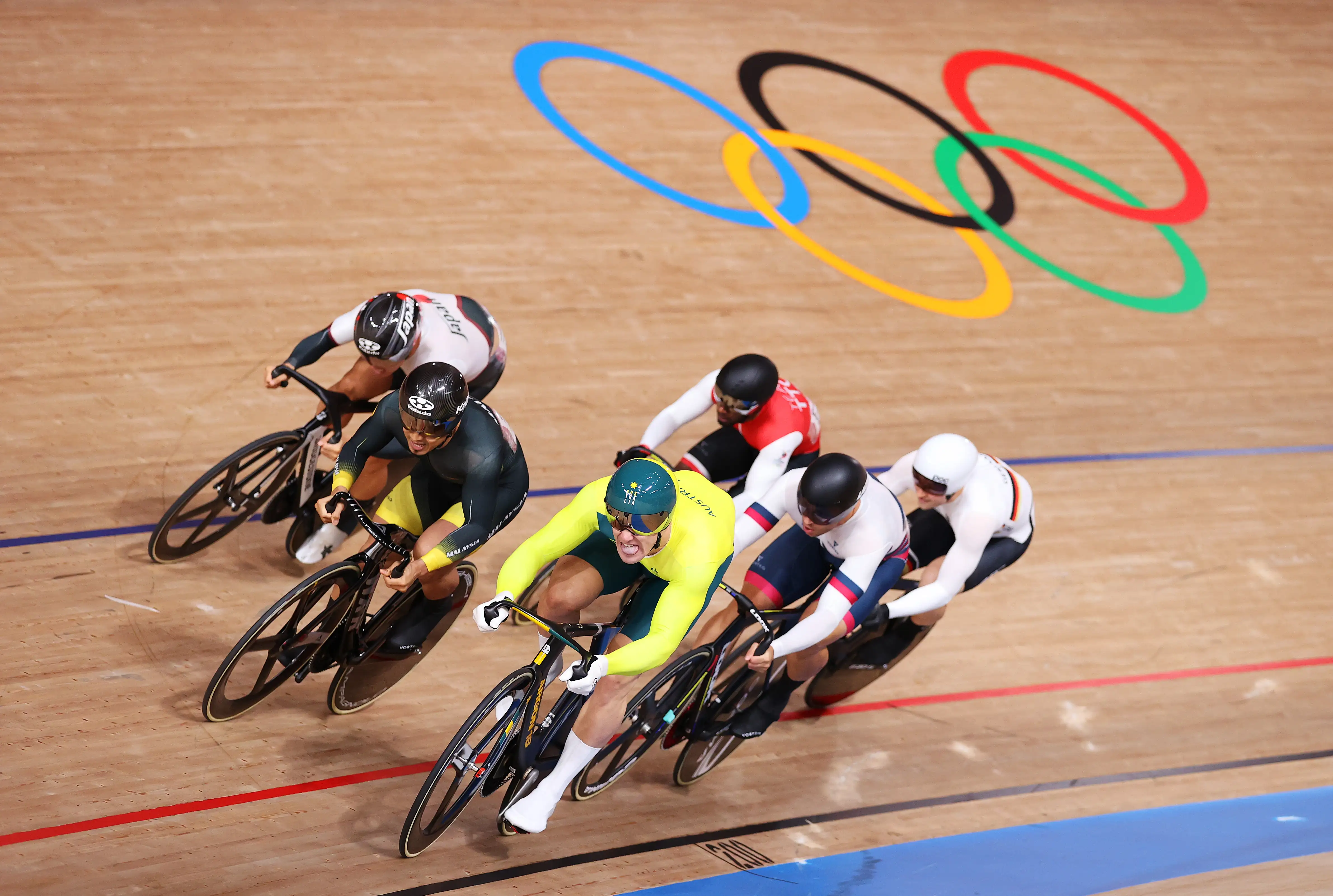 Matthew Glaetzer of Team Australia in a group of other cyclists sprint during the Men's Keirin quarterfinals 