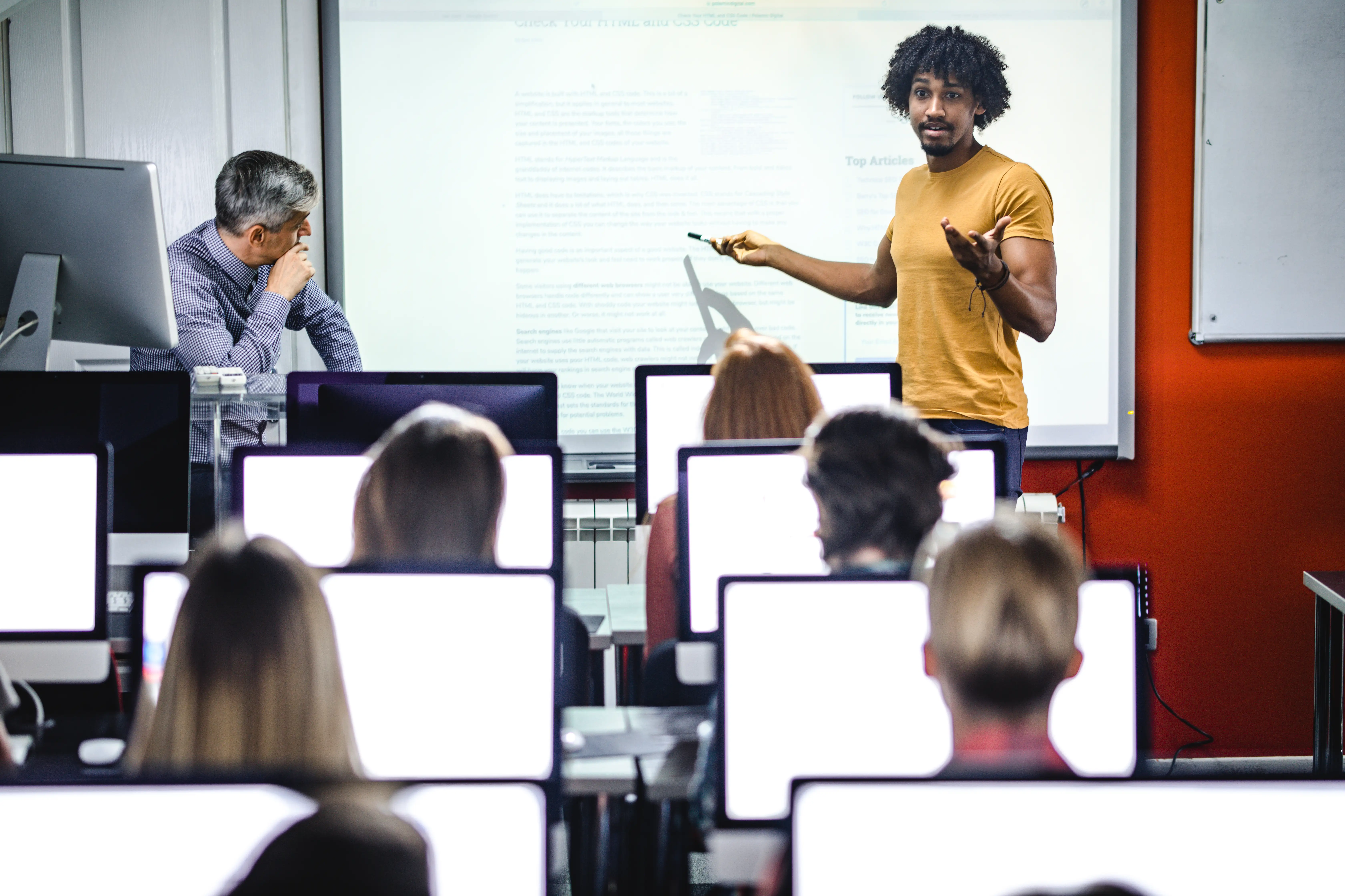 African American student presenting his classmates a lecture