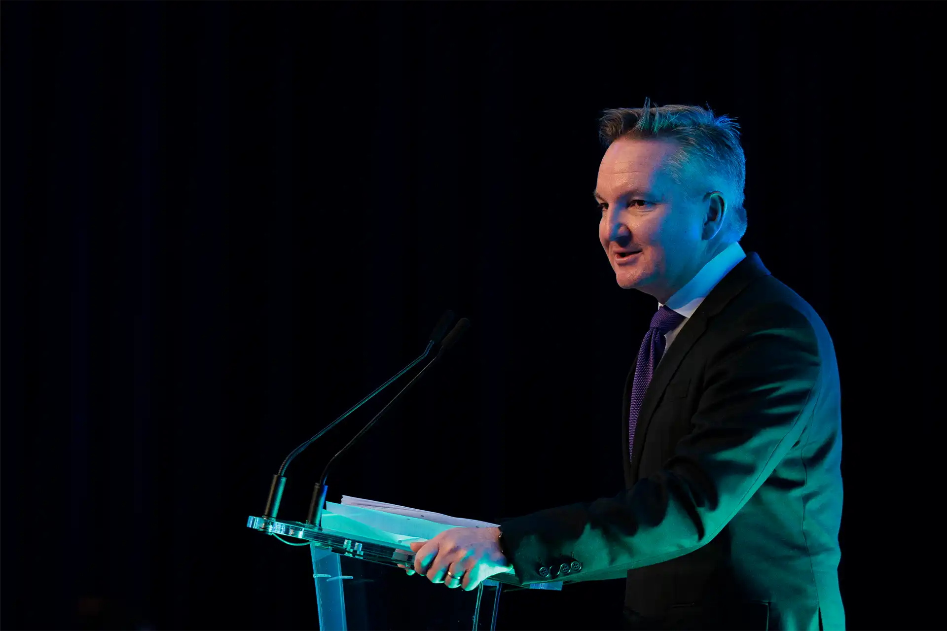 Chris Bowen speaking at a lecturn