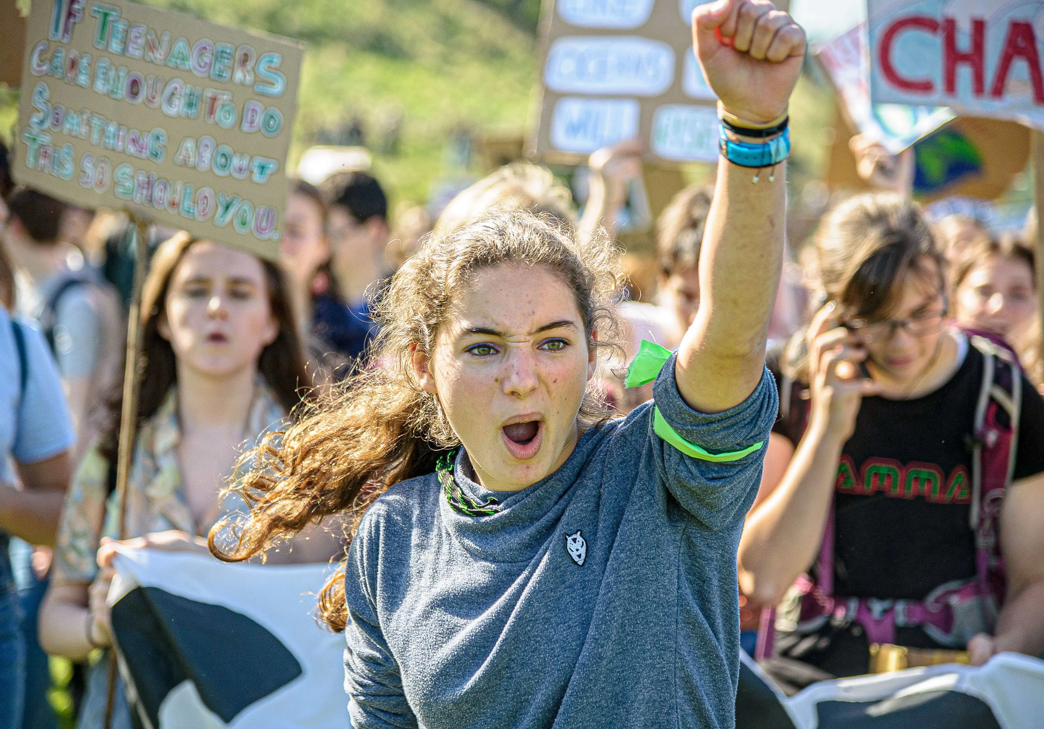 A young woman yells at a climate change rally