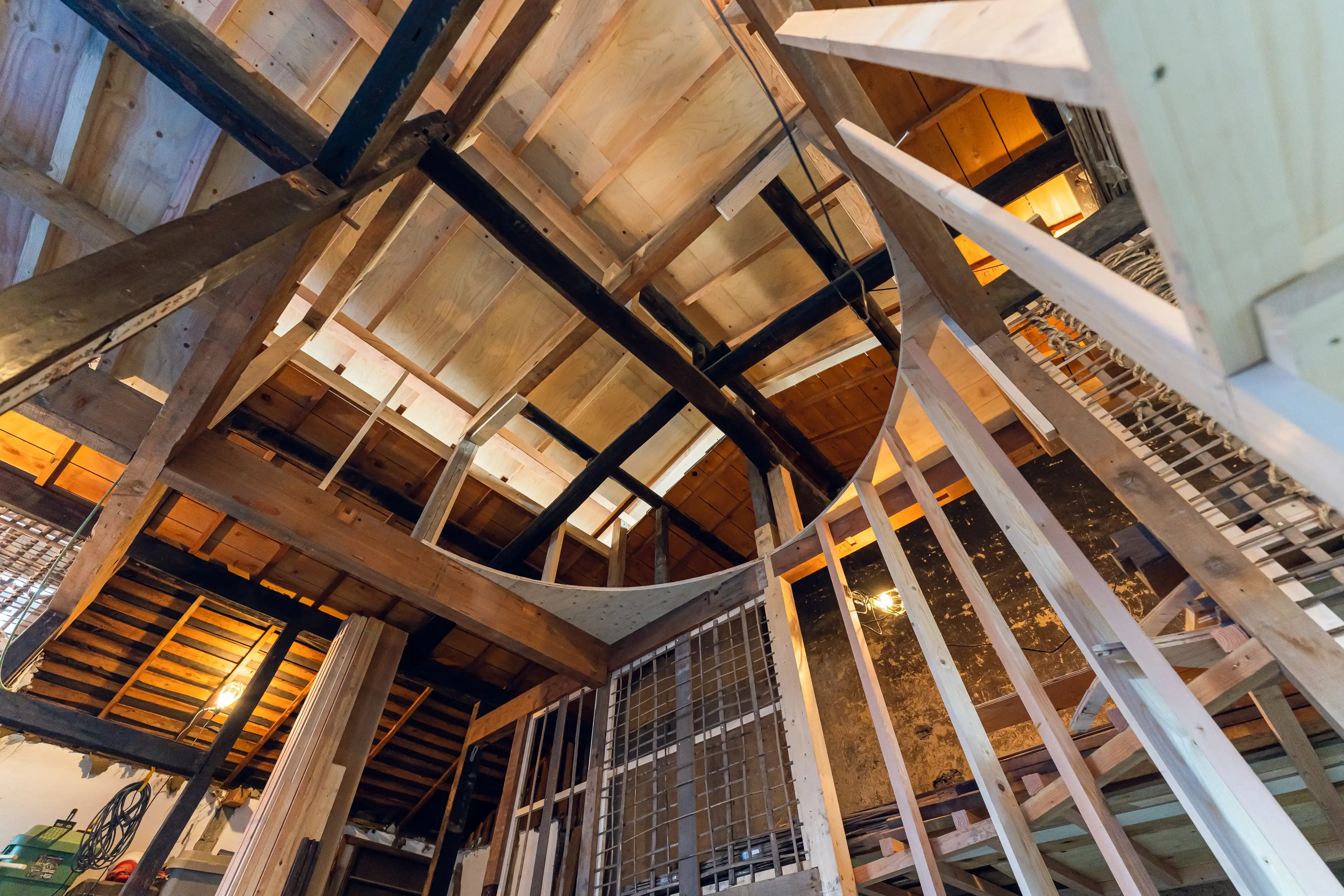 The inside of a house built with various colours and styles of timber