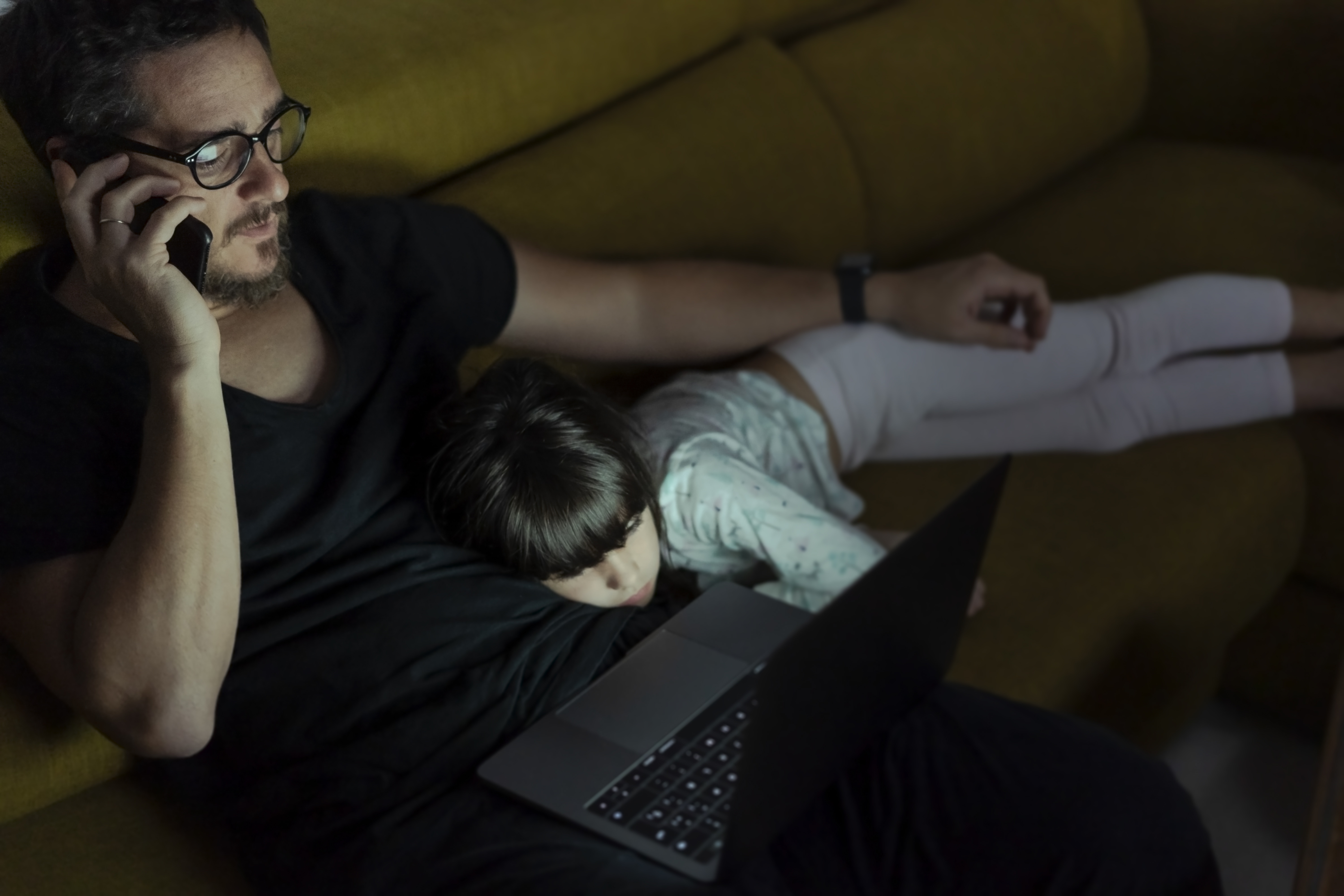 Man with daughter working 