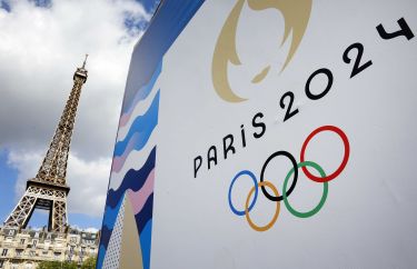 The Paris 2024 Olympics logo is displayed near the Eiffel Tower