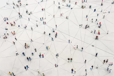 Overhead shot of crowd of people walking, connected by lines