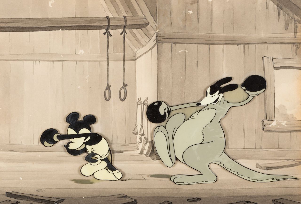 A still from a cartoon showing Mickey Mouse boxing a kangaroo