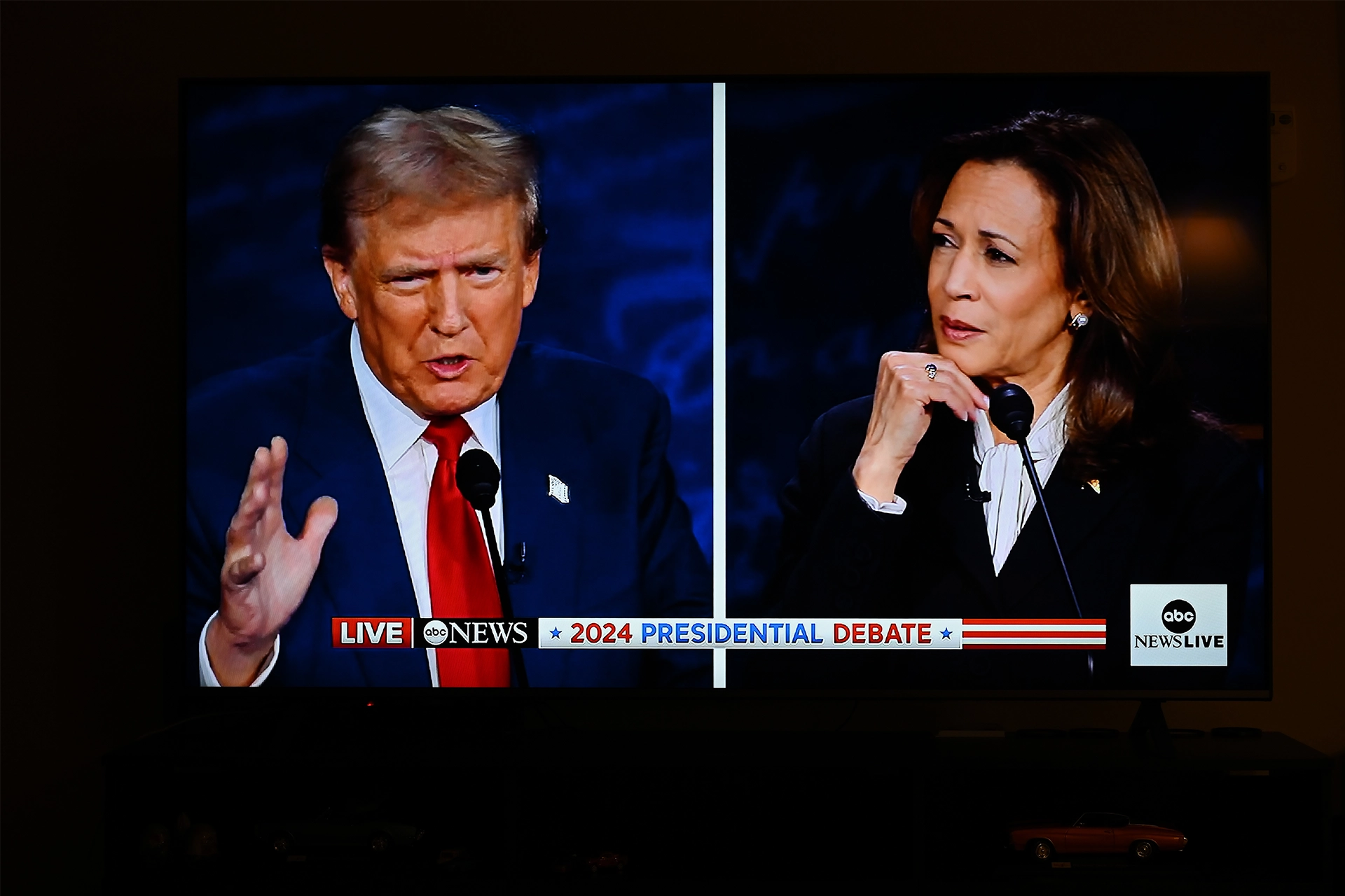 Television screen showing Donald Trump and Kamala Harris during 2024 US Presidential election