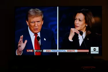 Television screen showing Donald Trump and Kamala Harris during 2024 US Presidential election