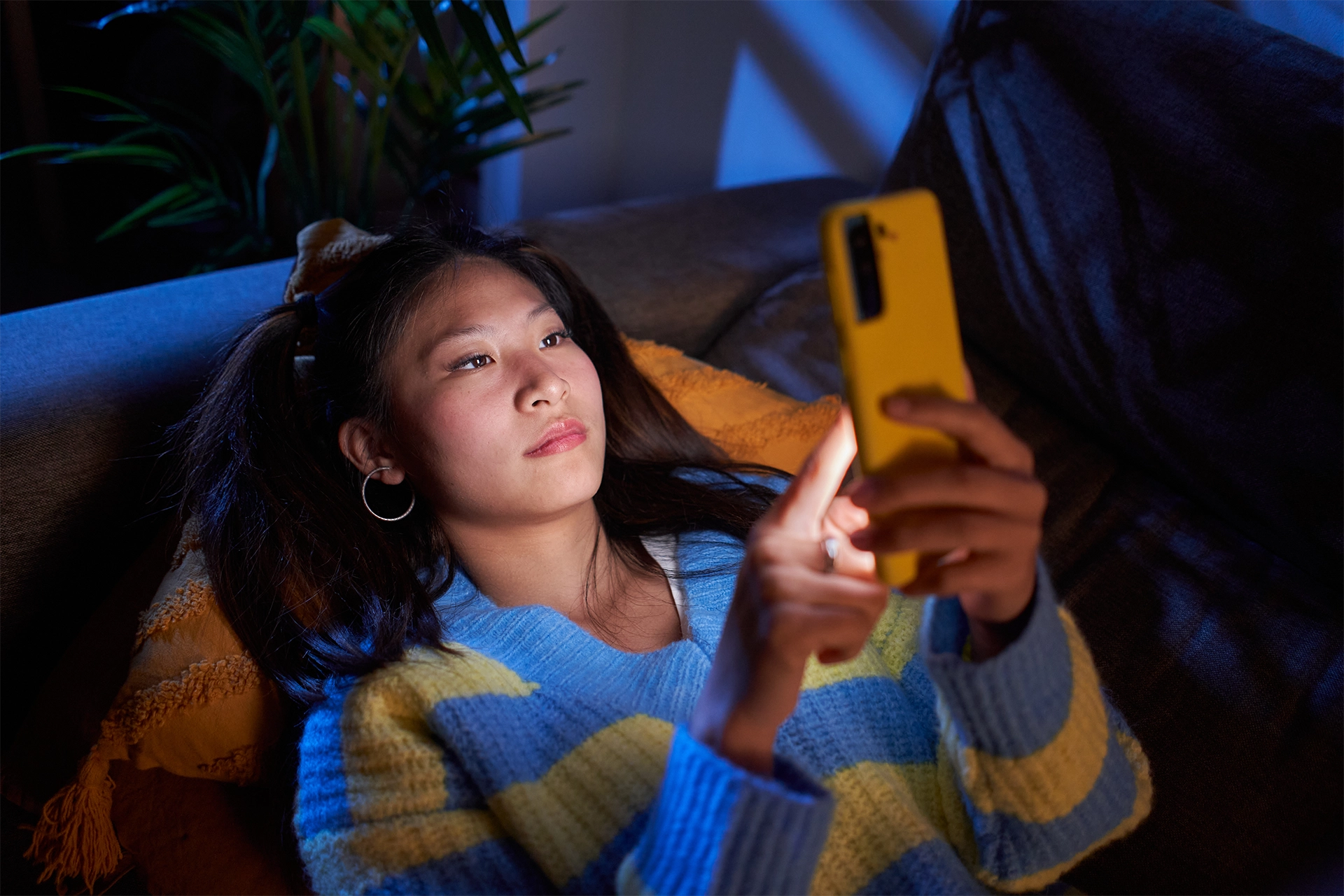 Young woman staring at phone