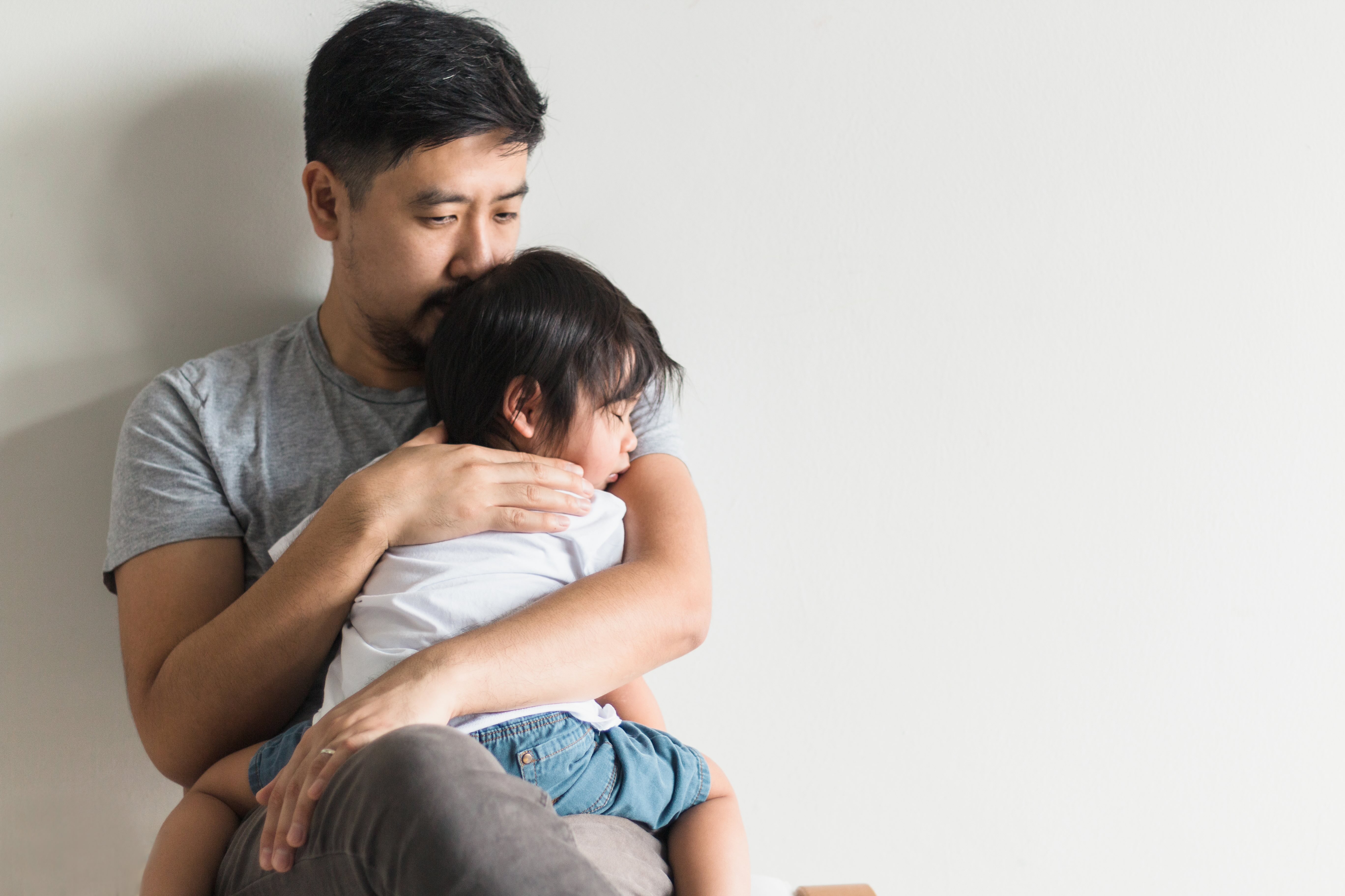 Dad with toddler at doctor surgery