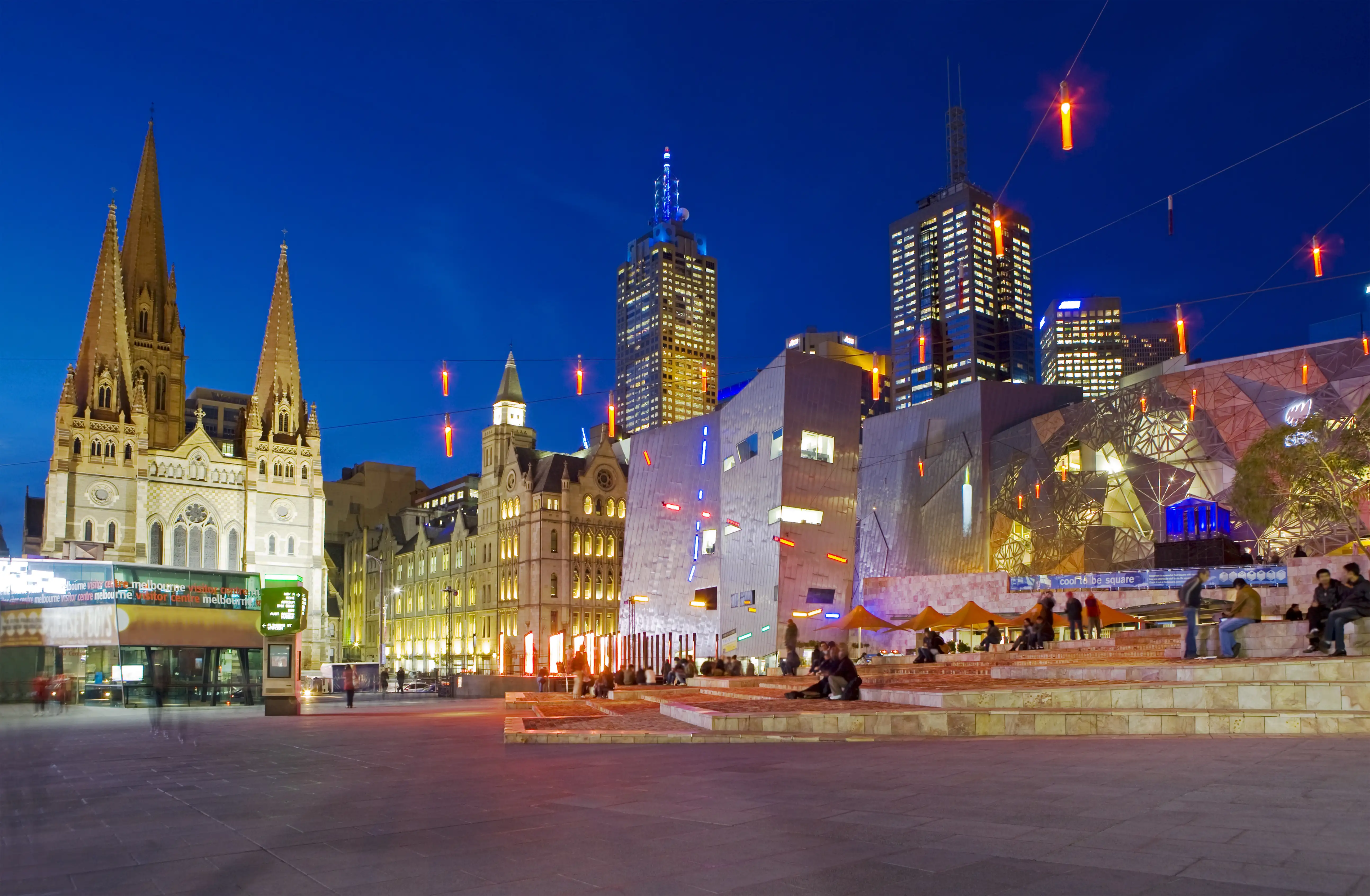 People in Melbourne’s Federation Square at night