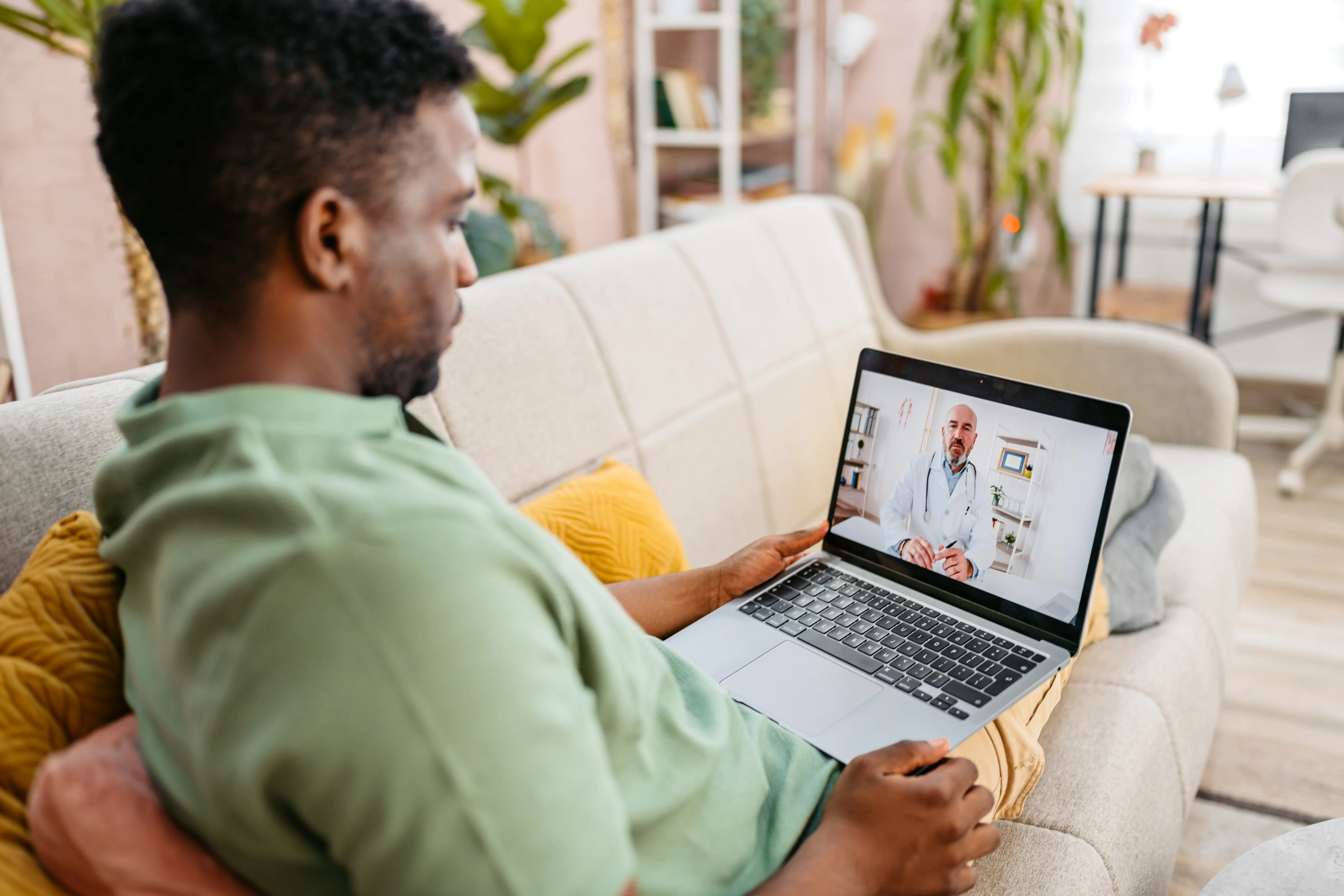 A man in a telehealth consultation