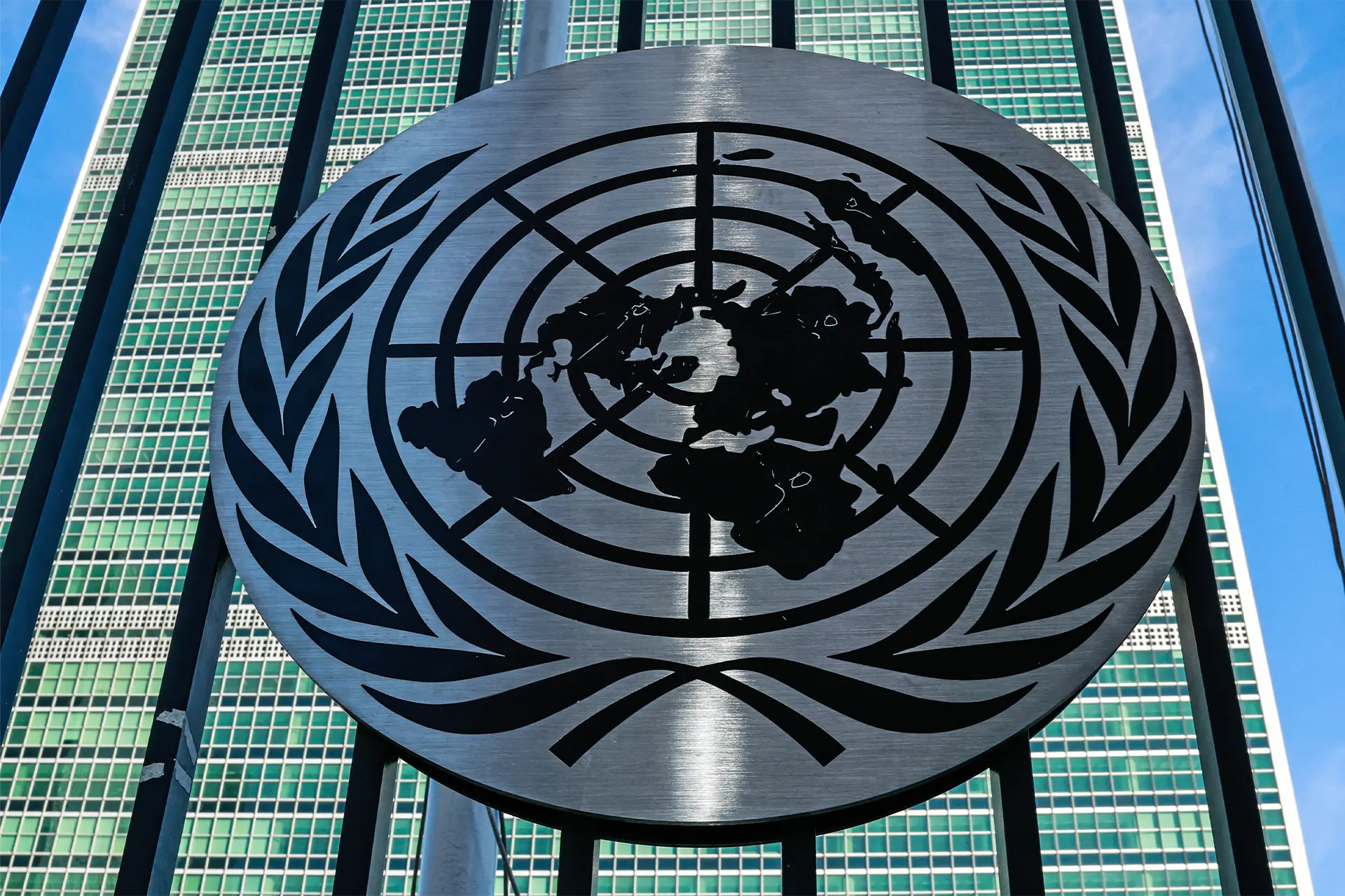 The United Nations symbol in front of the UN building in New York City