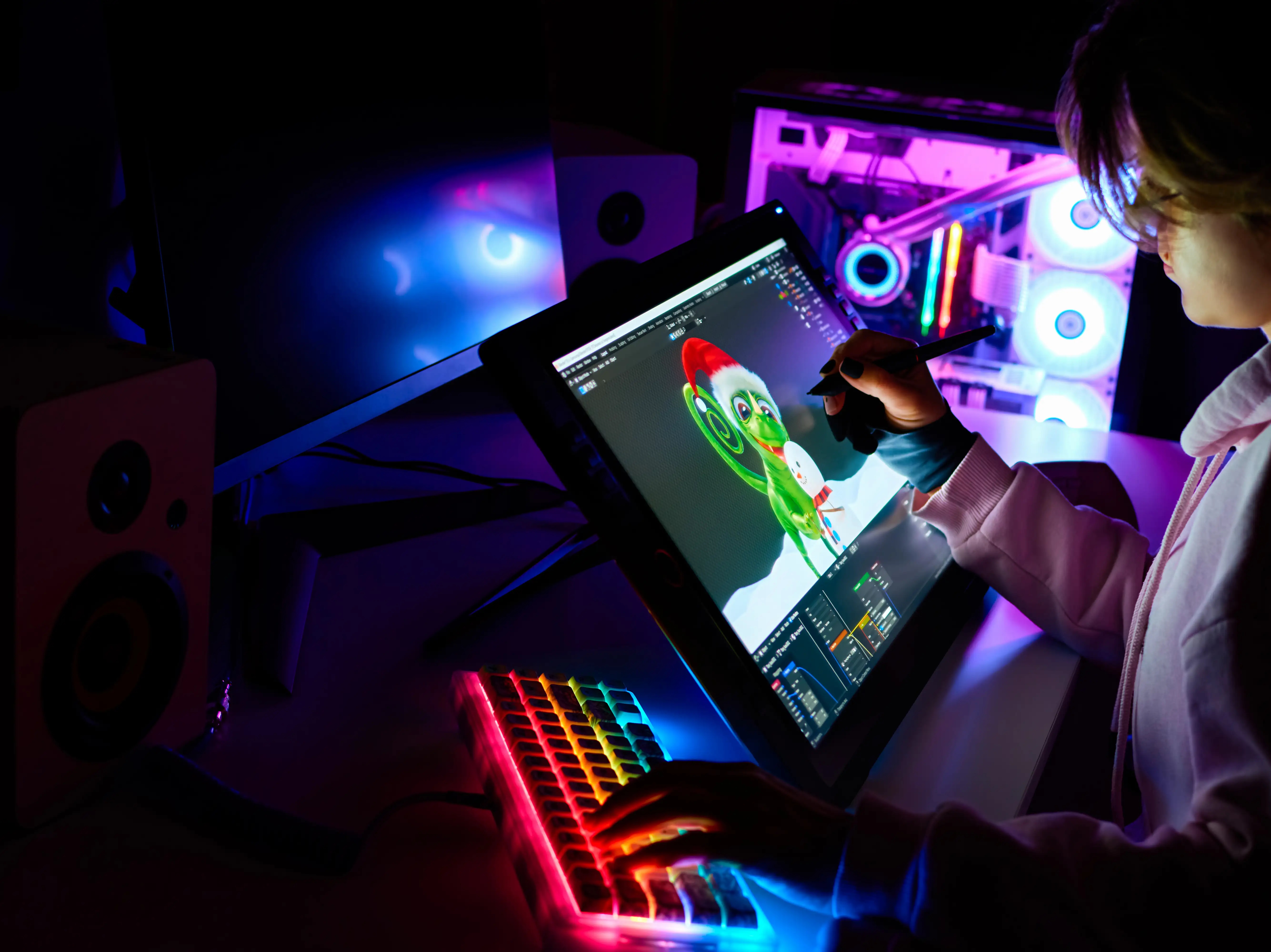 Female 3D designer is working on a project on a graphic tablet with a screen.