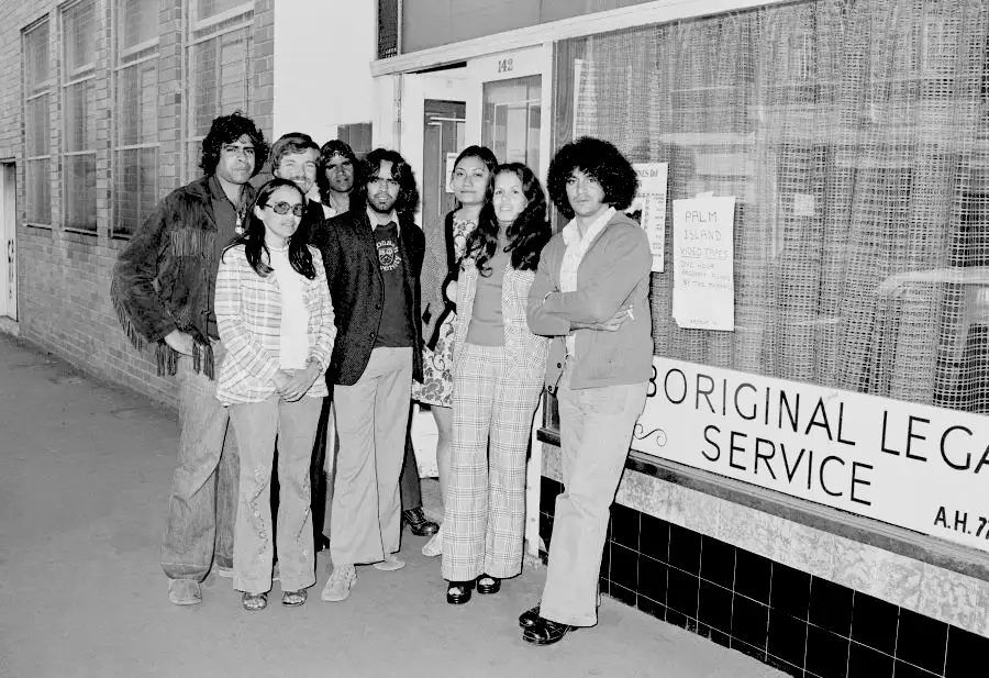 A group of young Indigenous legal workers standing in a group outside a legal centre in Sydney