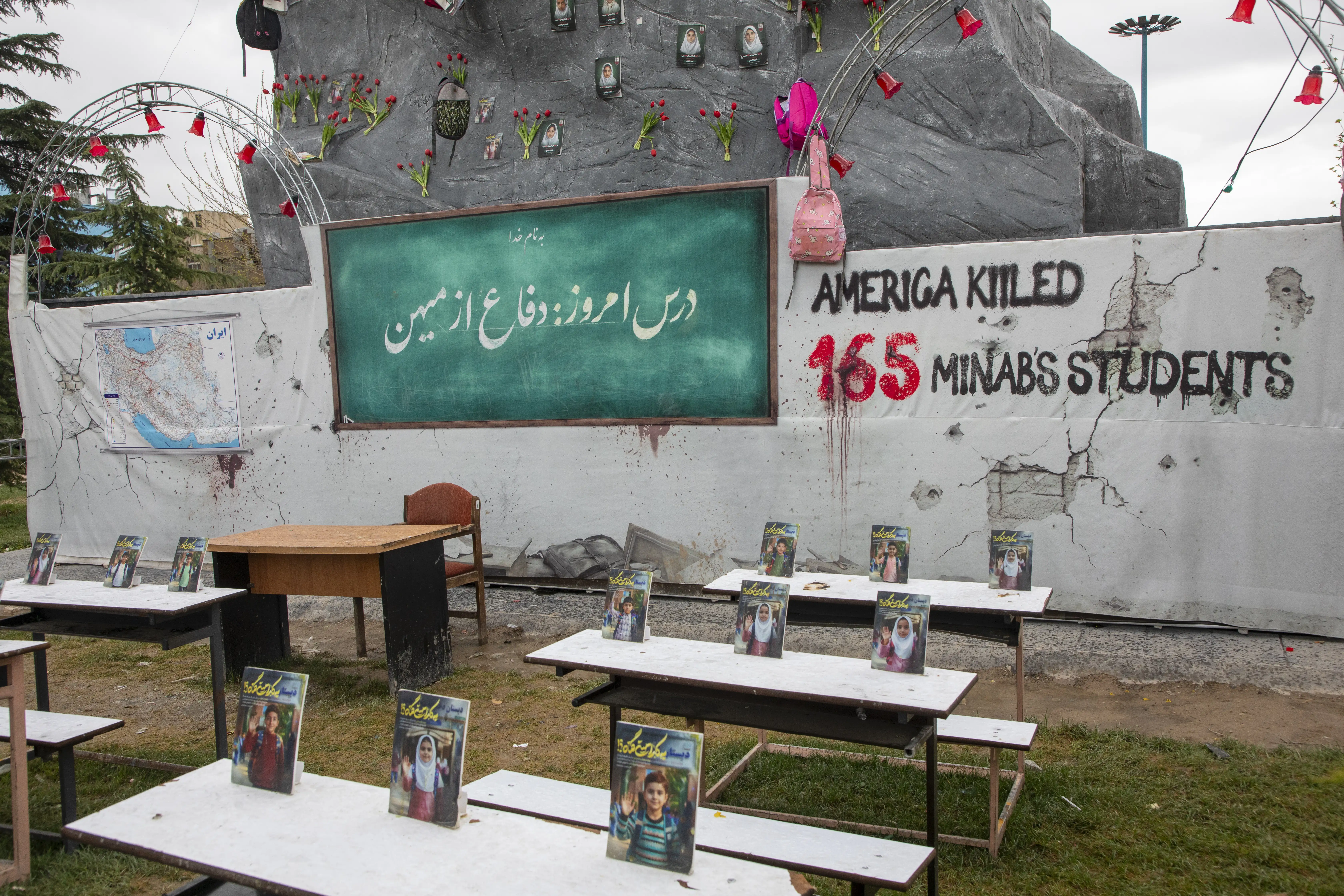 A real photo of a memorial for the victims of the Shajareh Tayyebeh primary school bombing.