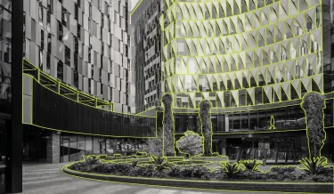 A black-and-white photo of Melbourne Connect with elements picked out in lime green