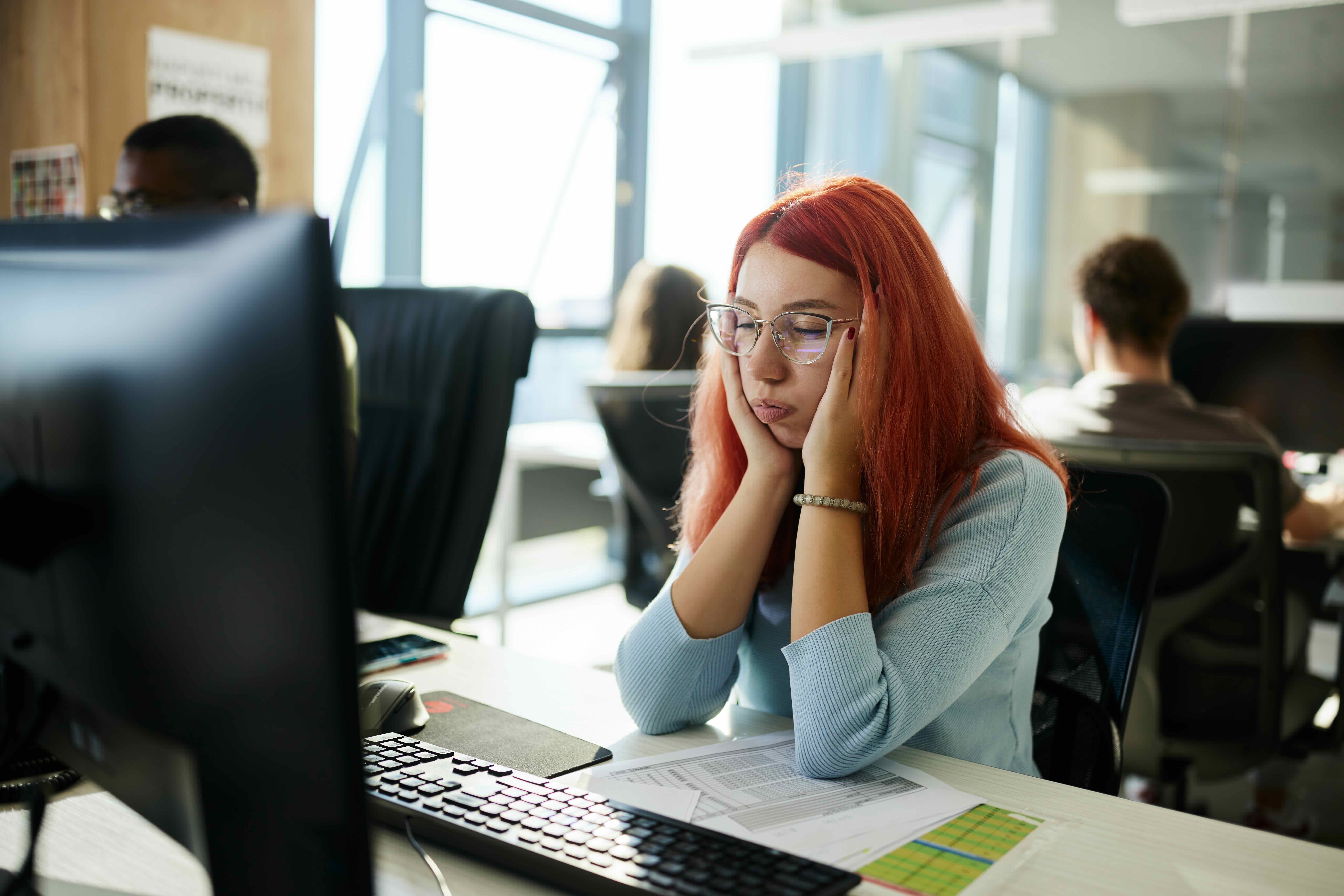 Young Woman Bored at work