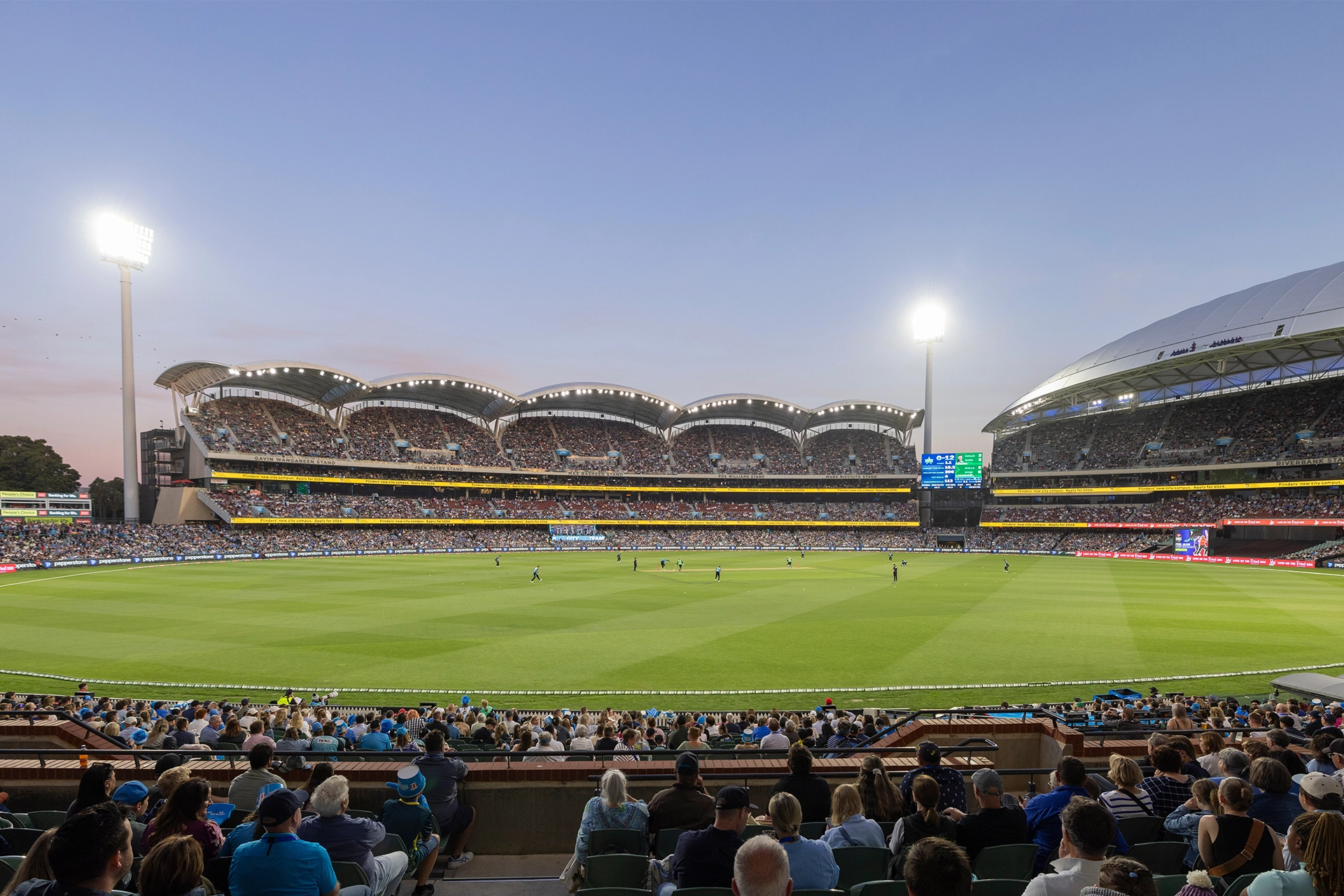 View of Melbourne Cricket Ground with crowds of people in stadium