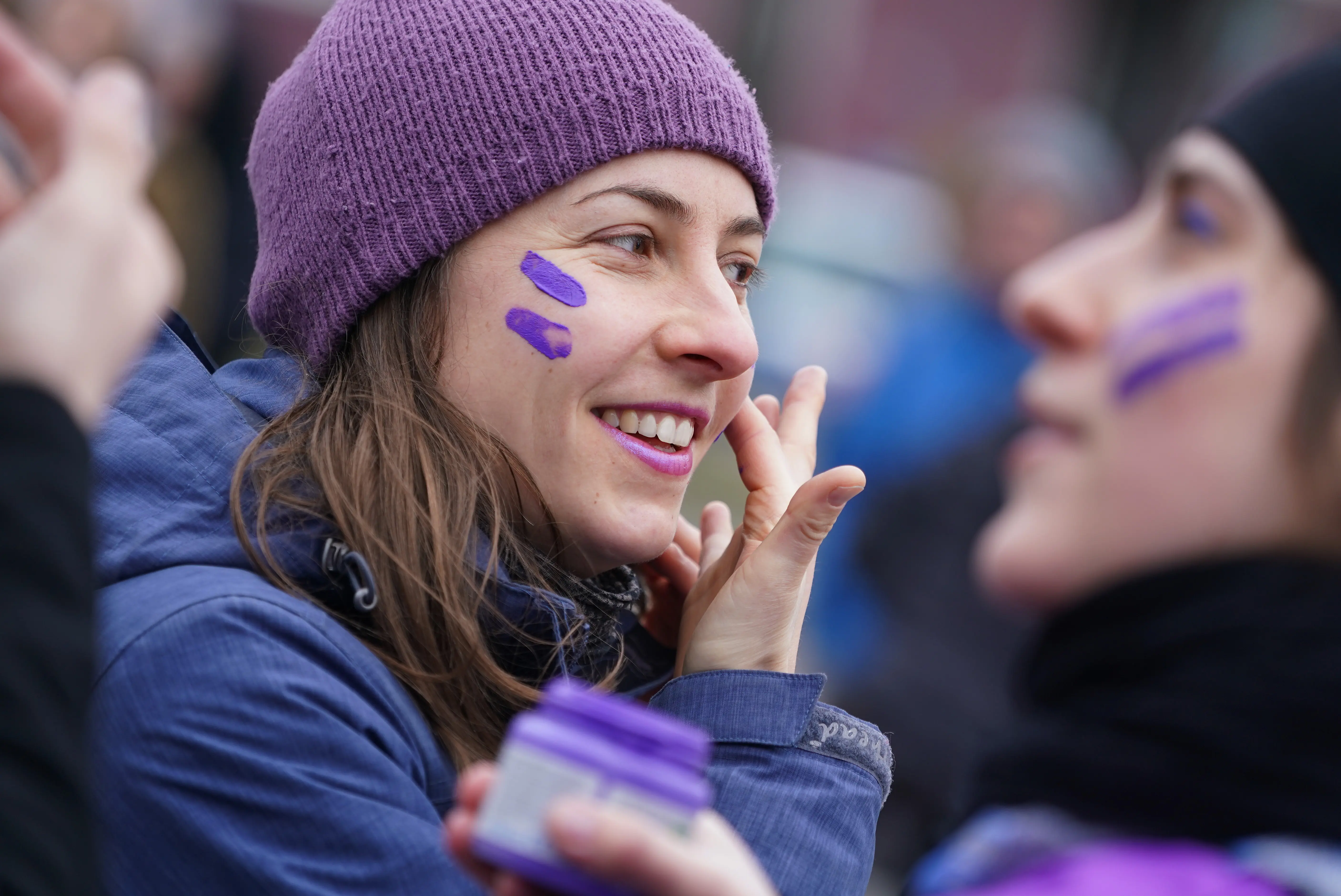 Women wearing purple prepare to support of women's rights