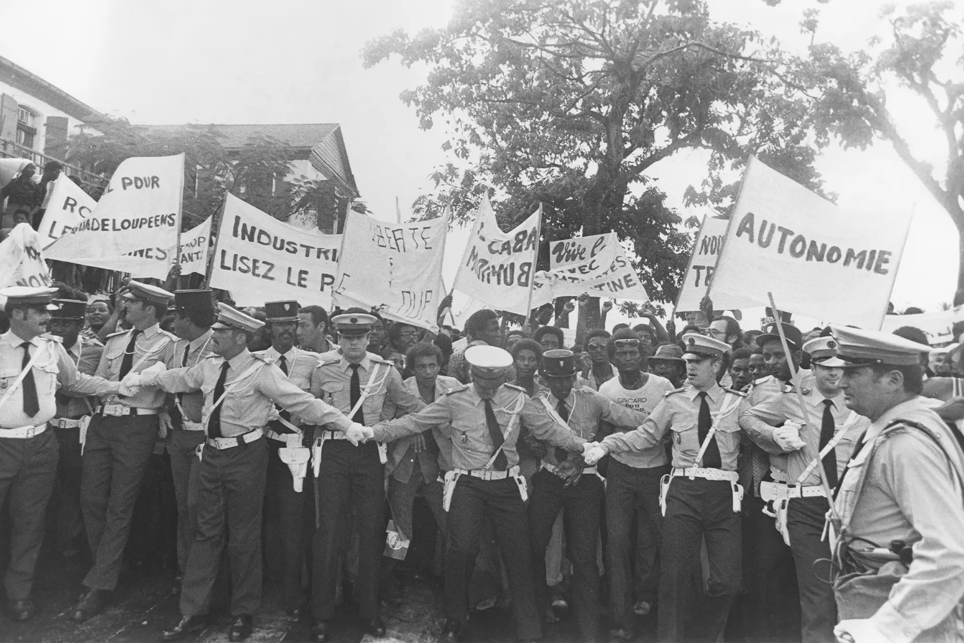 Police holding back protesters