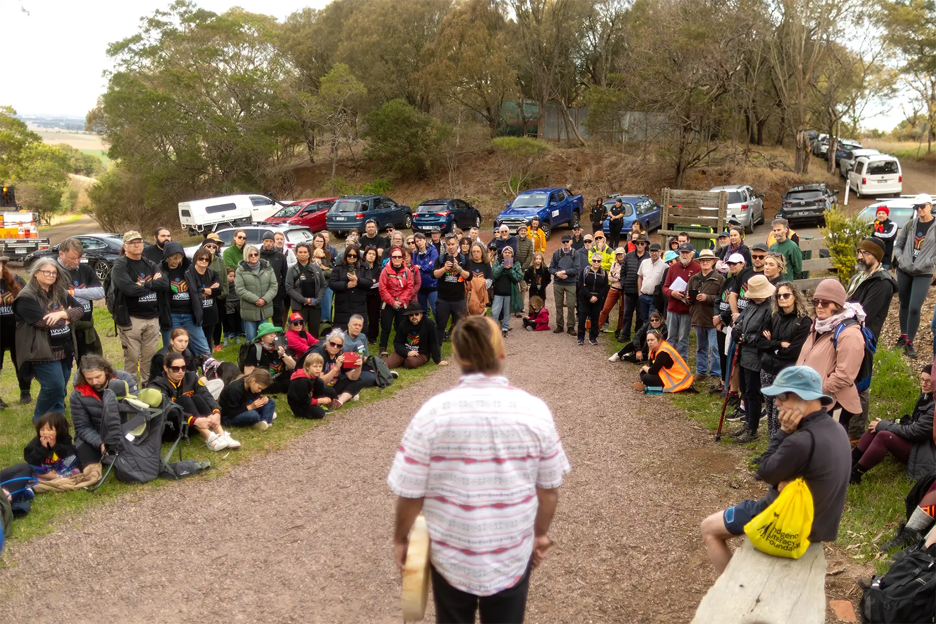 Man addressing a crowd of people