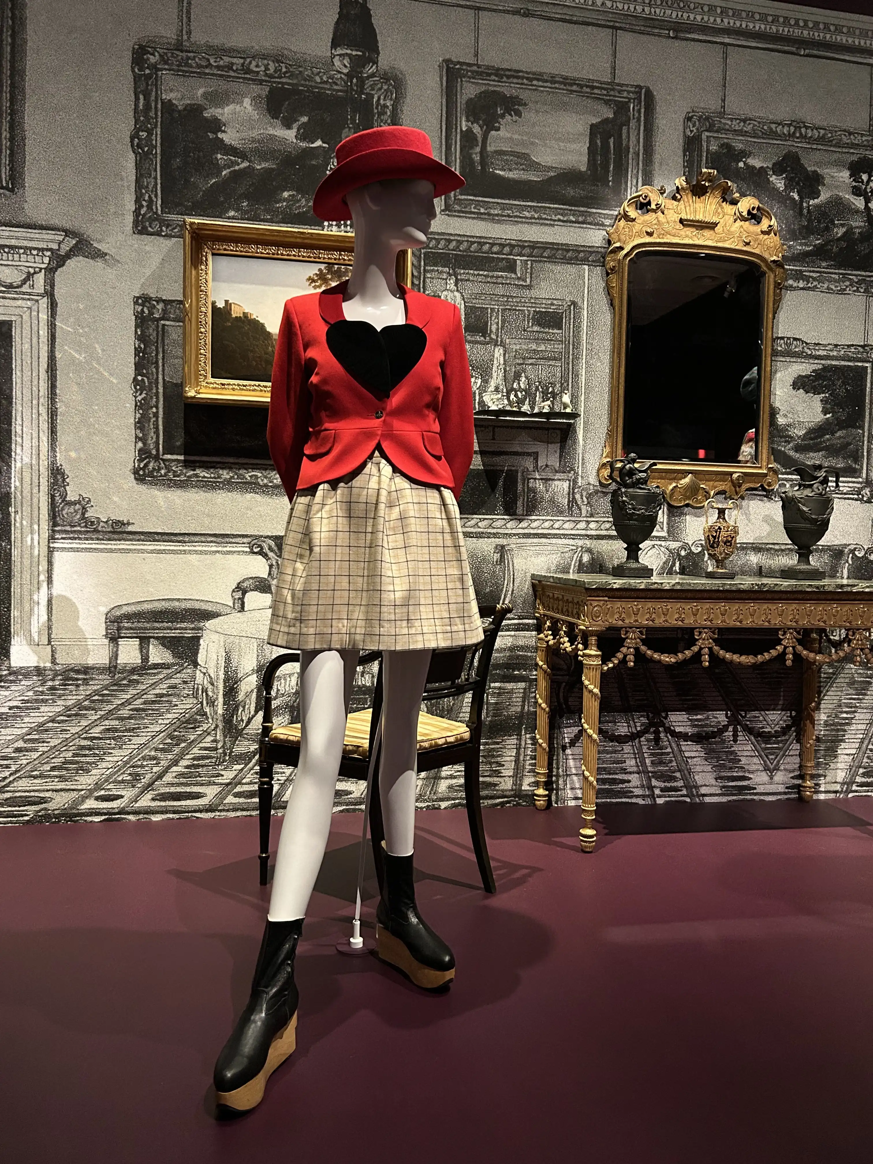 A Westwood designed skirt, hat, jacket and boots using tweed fabric on display at the National Gallery of Victoria