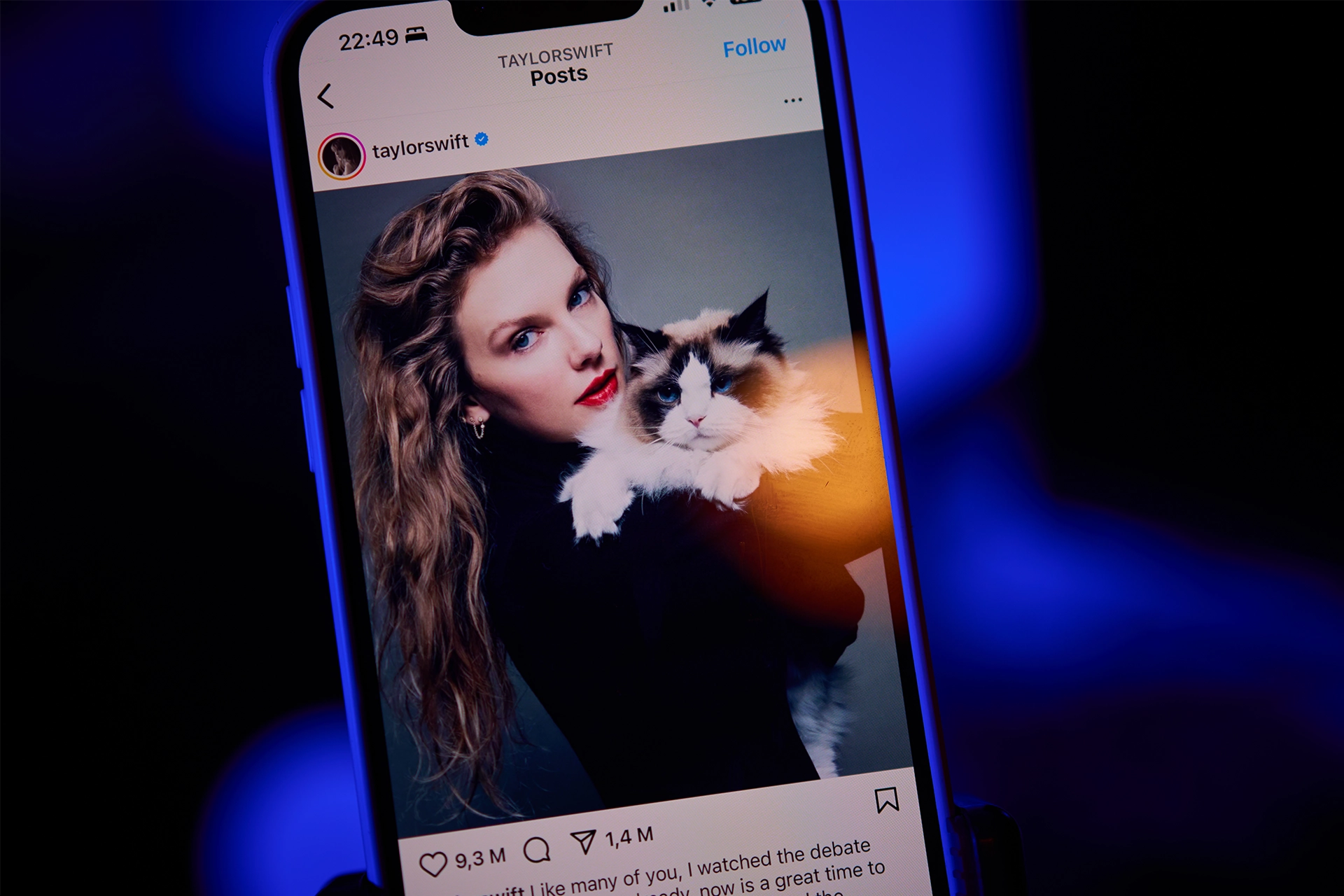 iPhone showing an Instagram post of Taylor Swift holding a cat