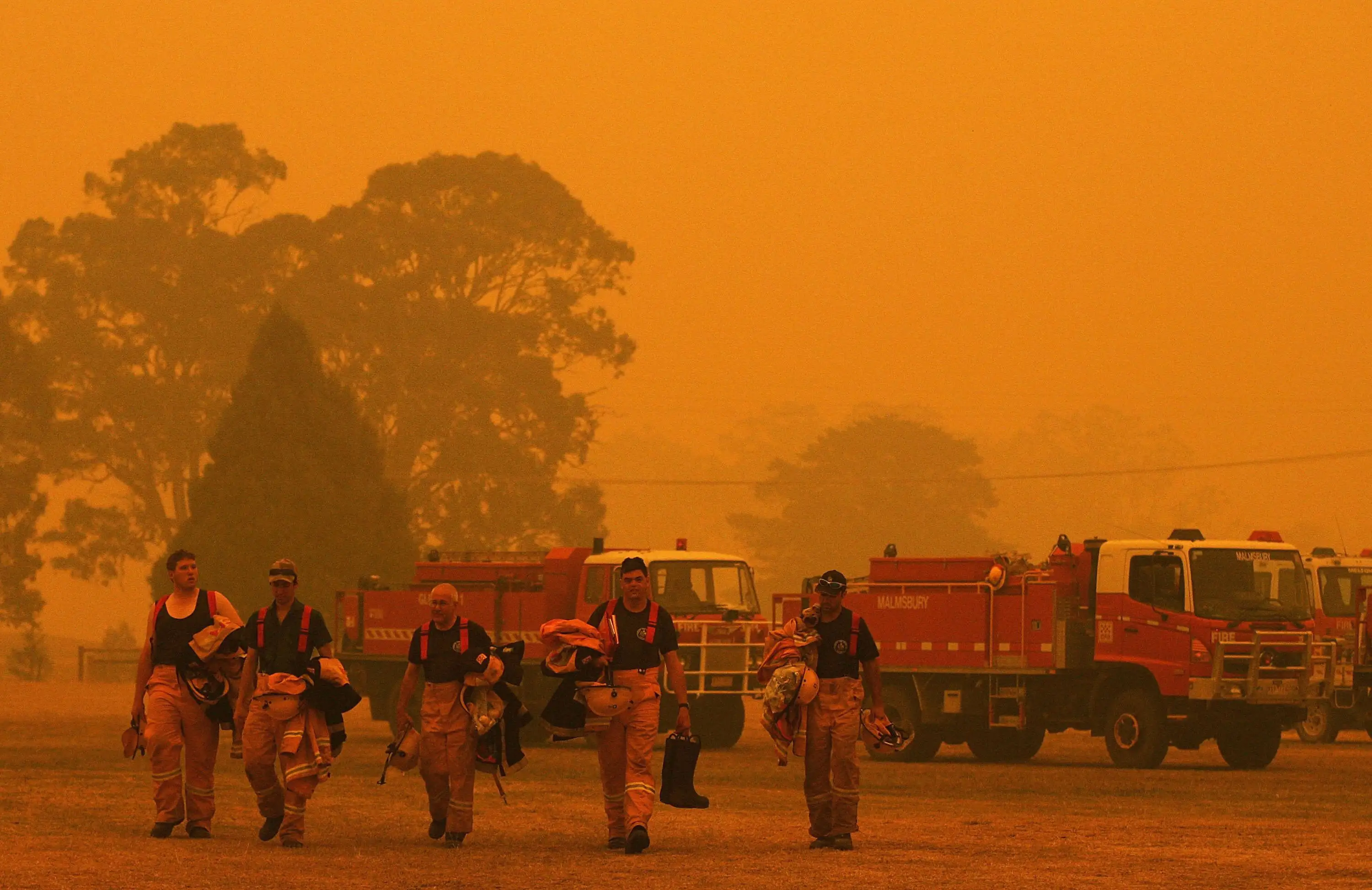 Fire fighters return to Briagolong base camp after battling bushfires on December 10, 2006 in Victoria.