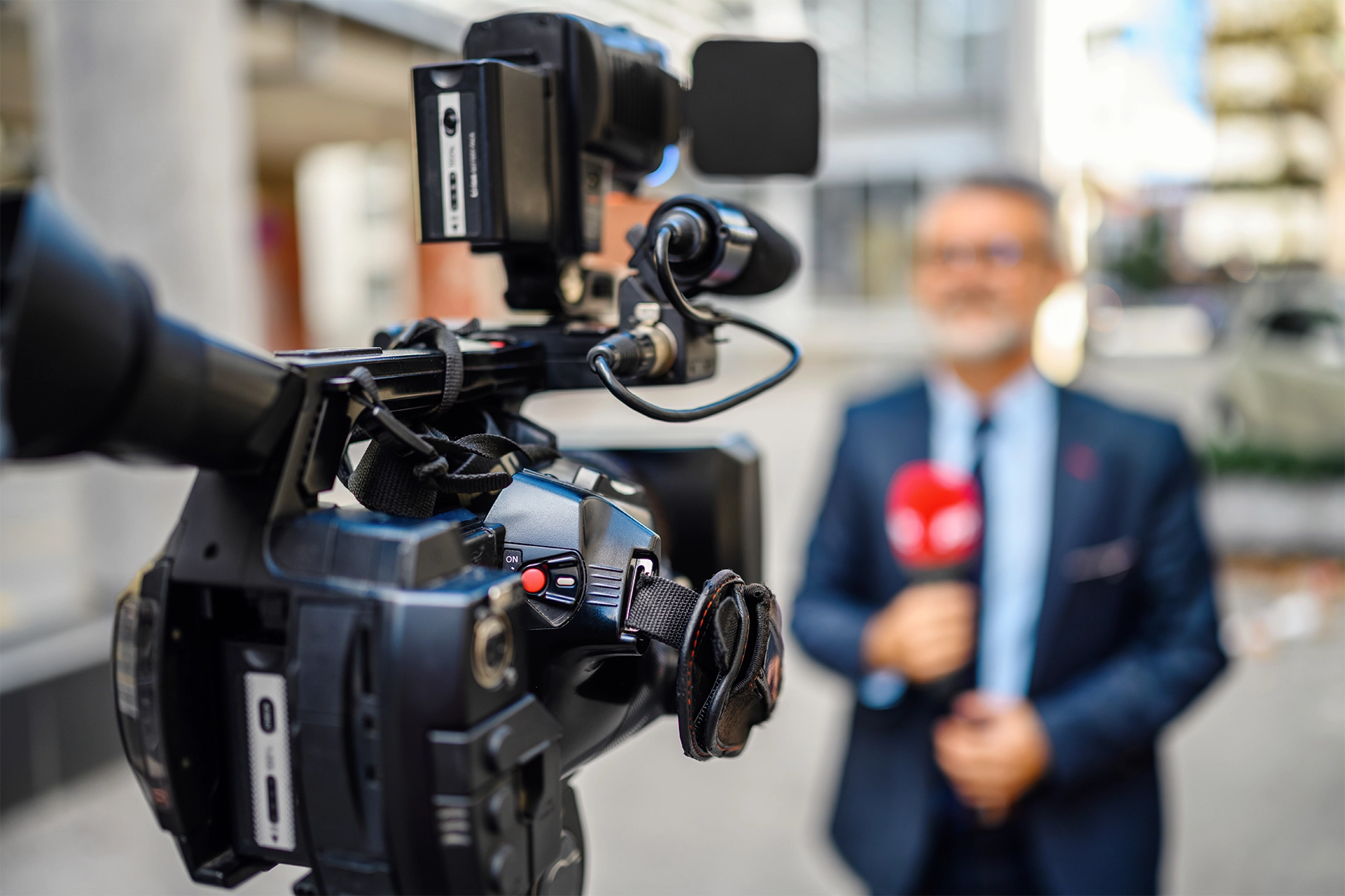 Reporter standing in front of a camera