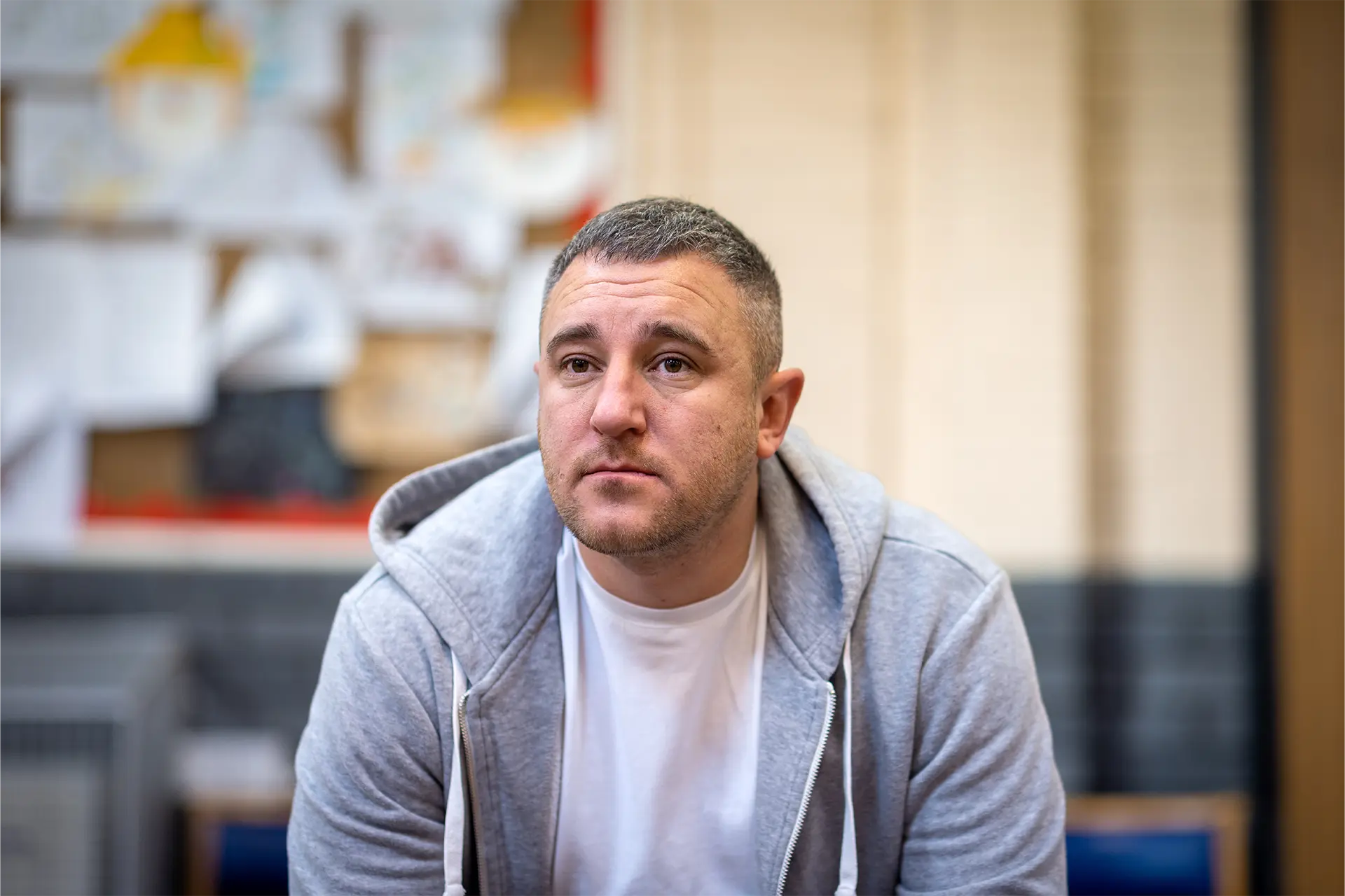 Man sitting and looking worried